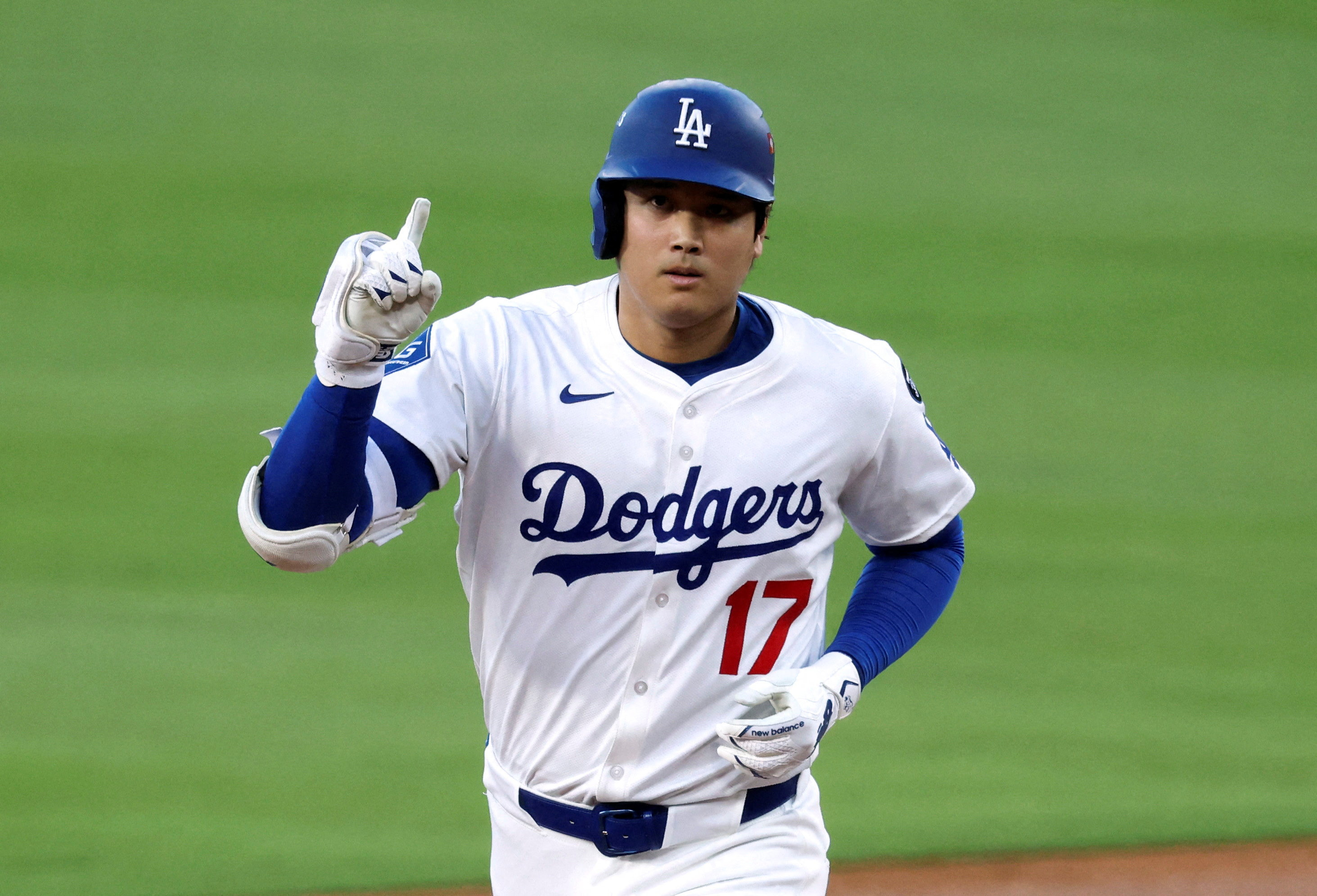 Oct 17, 2025; Los Angeles, California, USA; Los Angeles Dodgers two-way player Shohei Ohtani (17) rounds the bases on his home run against the Milwaukee Brewers during the first inning of game four of the NLCS round for the 2025 MLB playoffs at Dodger Stadium. Mandatory Credit: Kiyoshi Mio-Imagn Images TPX IMAGES OF THE DAY
