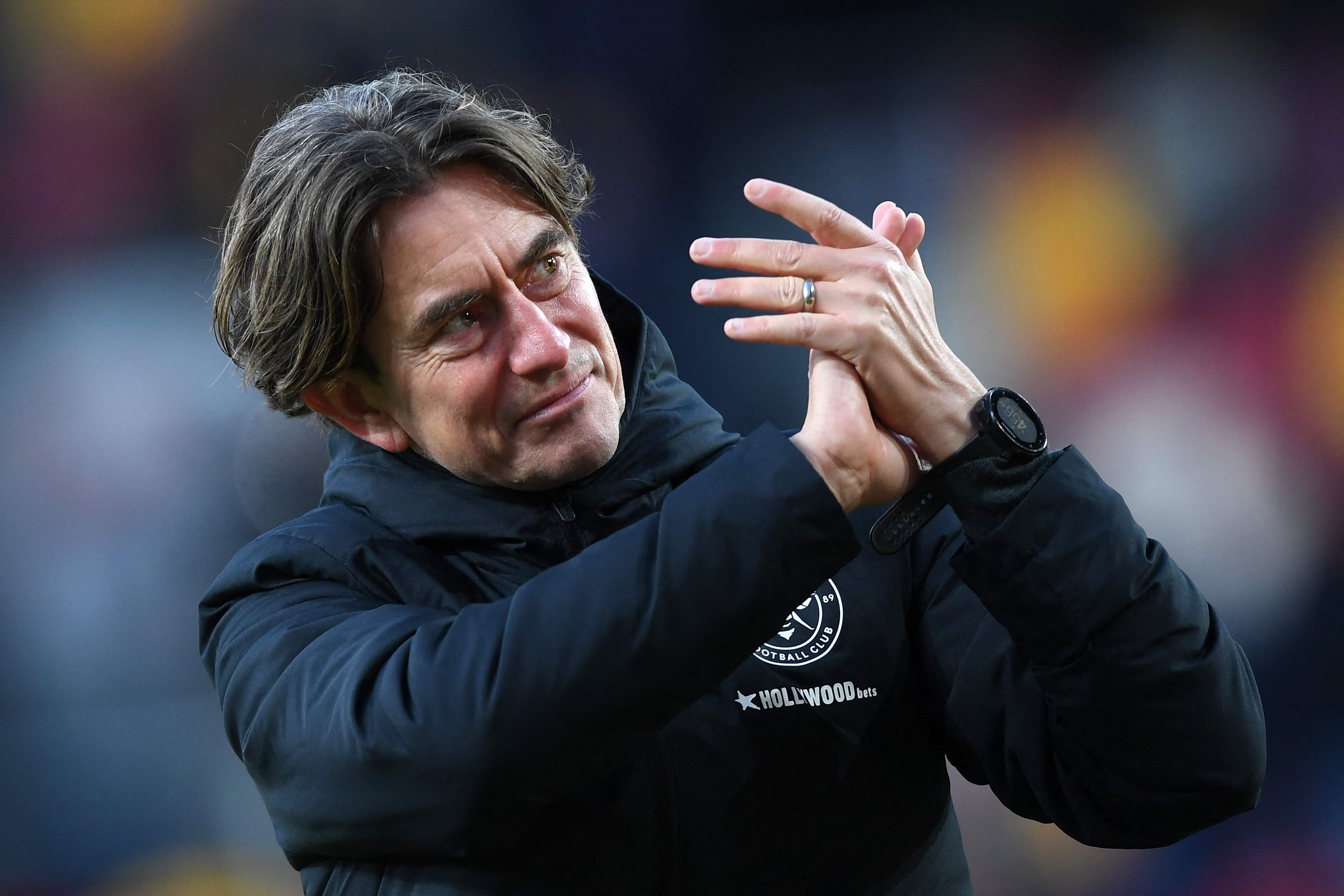 Brentford's Danish head coach Thomas Frank applauds the fans following the English Premier League football match between Brentford and Crystal Palace at Brentford Community Stadium in London on February 12, 2022. (Photo by Daniel LEAL / AFP) / RESTRICTED TO EDITORIAL USE. No use with unauthorized audio, video, data, fixture lists, club/league logos or 'live' services. Online in-match use limited to 120 images. An additional 40 images may be used in extra time. No video emulation. Social media in-match use limited to 120 images. An additional 40 images may be used in extra time. No use in betting publications, games or single club/league/player publications. / 