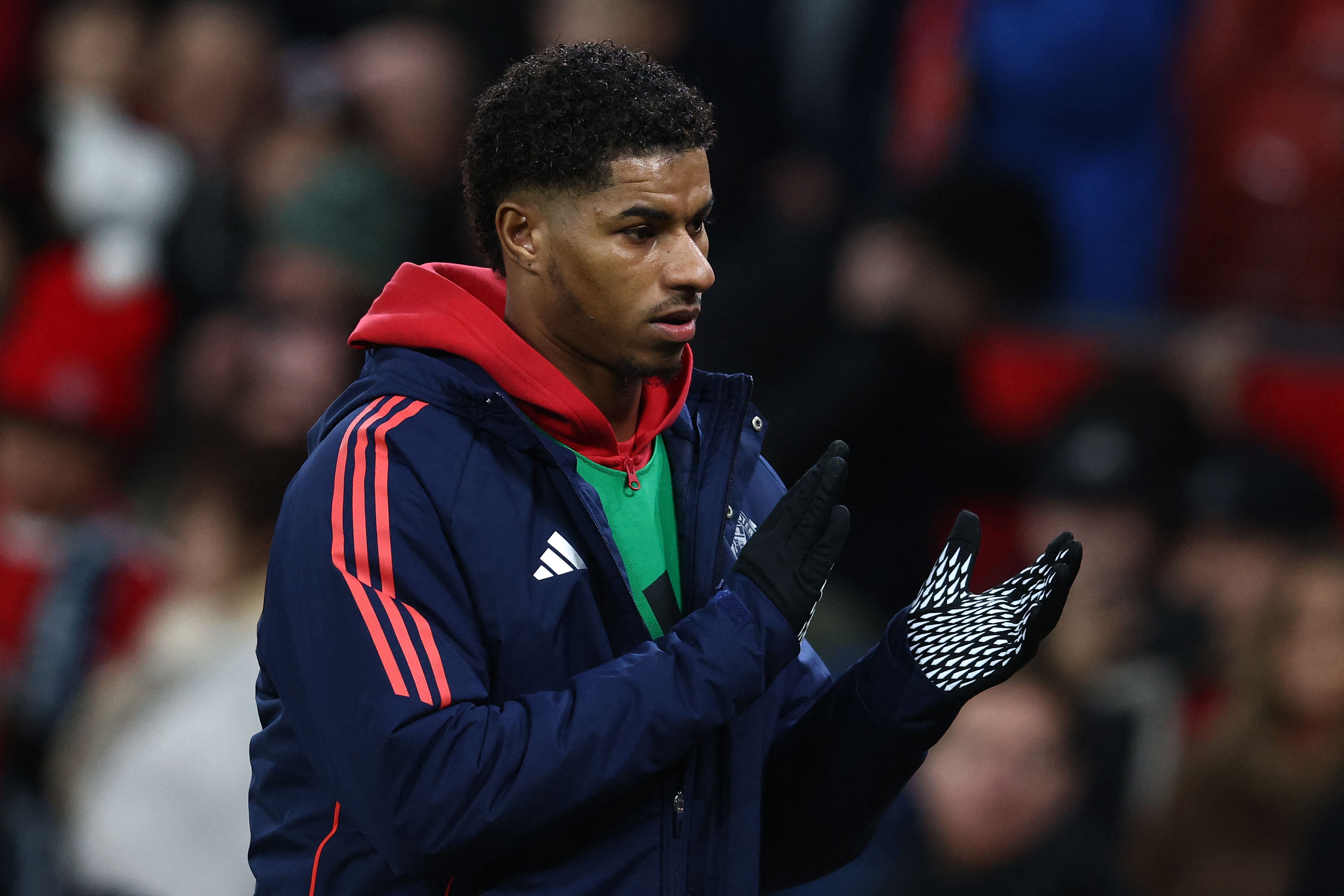 Manchester United's English striker #10 Marcus Rashford applauds the fans following the English Premier League football match between Manchester United and Newcastle United at Old Trafford in Manchester, north west England, on December 30, 2024. Newcastle won the match 2-0. (Photo by Darren Staples / AFP) / RESTRICTED TO EDITORIAL USE. No use with unauthorized audio, video, data, fixture lists, club/league logos or 'live' services. Online in-match use limited to 120 images. An additional 40 images may be used in extra time. No video emulation. Social media in-match use limited to 120 images. An additional 40 images may be used in extra time. No use in betting publications, games or single club/league/player publications. / 