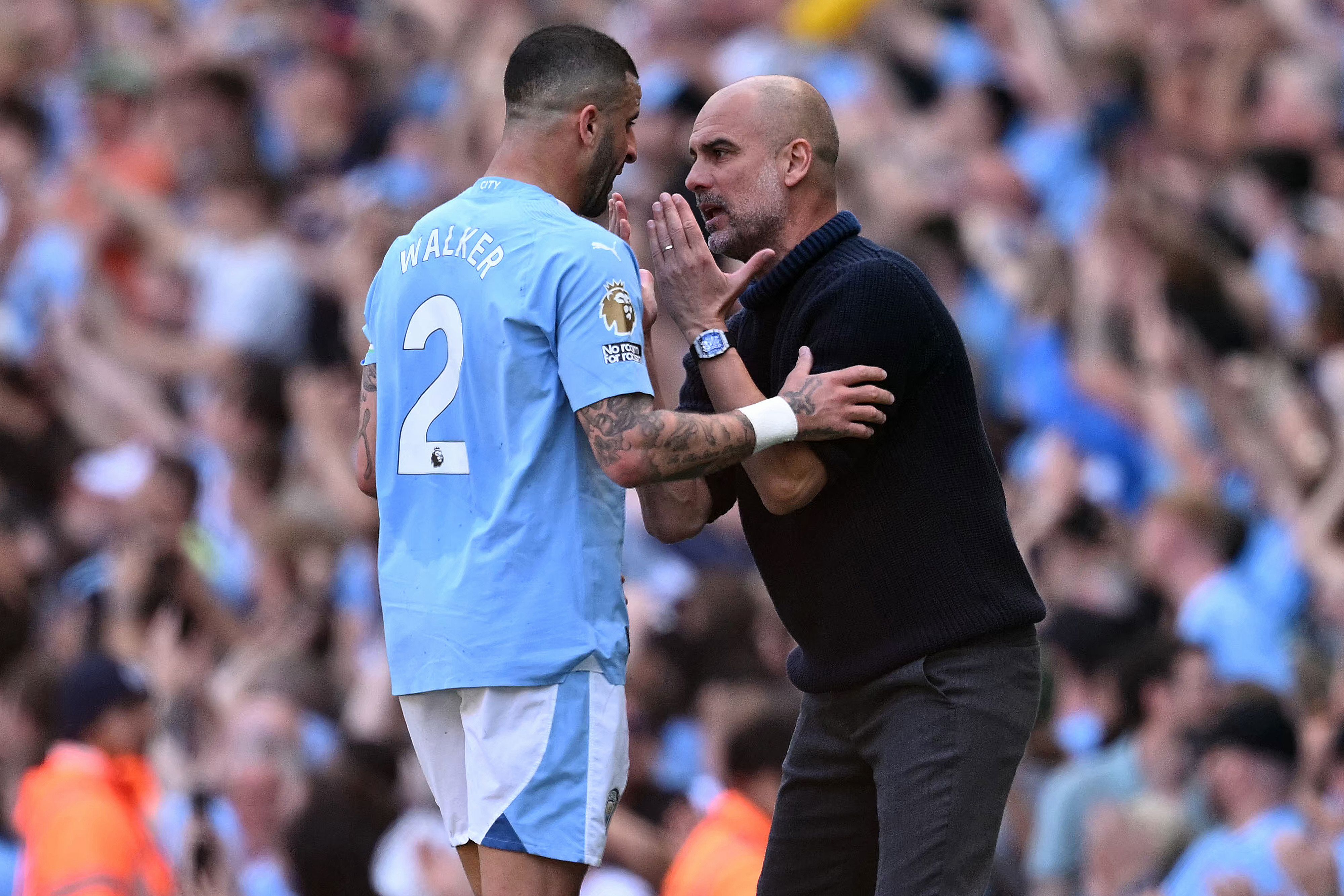 Manchester City's Spanish manager Pep Guardiola gives instructions to Manchester City's English defender #02 Kyle Walker during the English Premier League football match between Manchester City and West Ham United at the Etihad Stadium in Manchester, north west England, on May 19, 2024. (Photo by Oli SCARFF / AFP) / RESTRICTED TO EDITORIAL USE. No use with unauthorized audio, video, data, fixture lists, club/league logos or 'live' services. Online in-match use limited to 120 images. An additional 40 images may be used in extra time. No video emulation. Social media in-match use limited to 120 images. An additional 40 images may be used in extra time. No use in betting publications, games or single club/league/player publications. / 