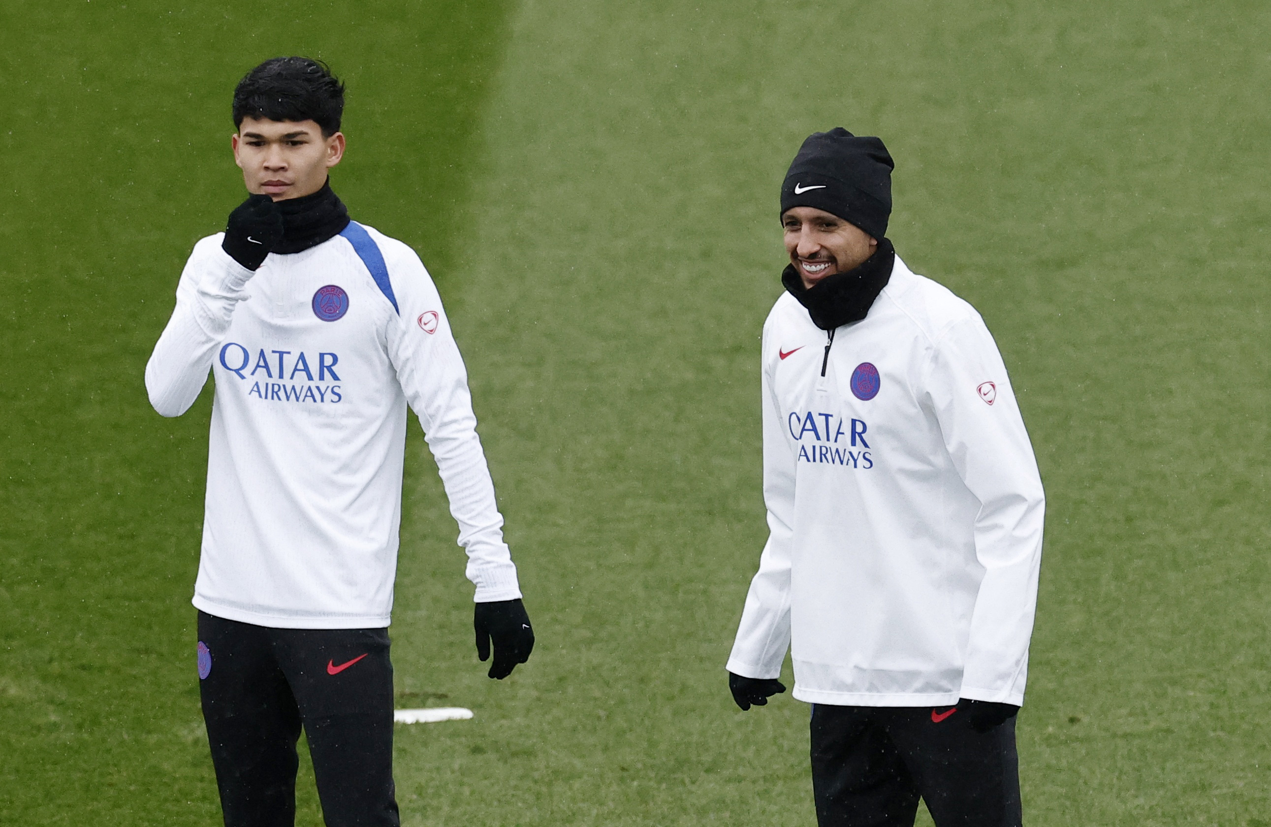 Soccer Football - UEFA Champions League - Paris St Germain Training - Campus Paris St Germain, Poissy, France - January 27, 2026 Paris St Germain's Dro Fernandez and Marquinhos during training REUTERS/Benoit Tessier