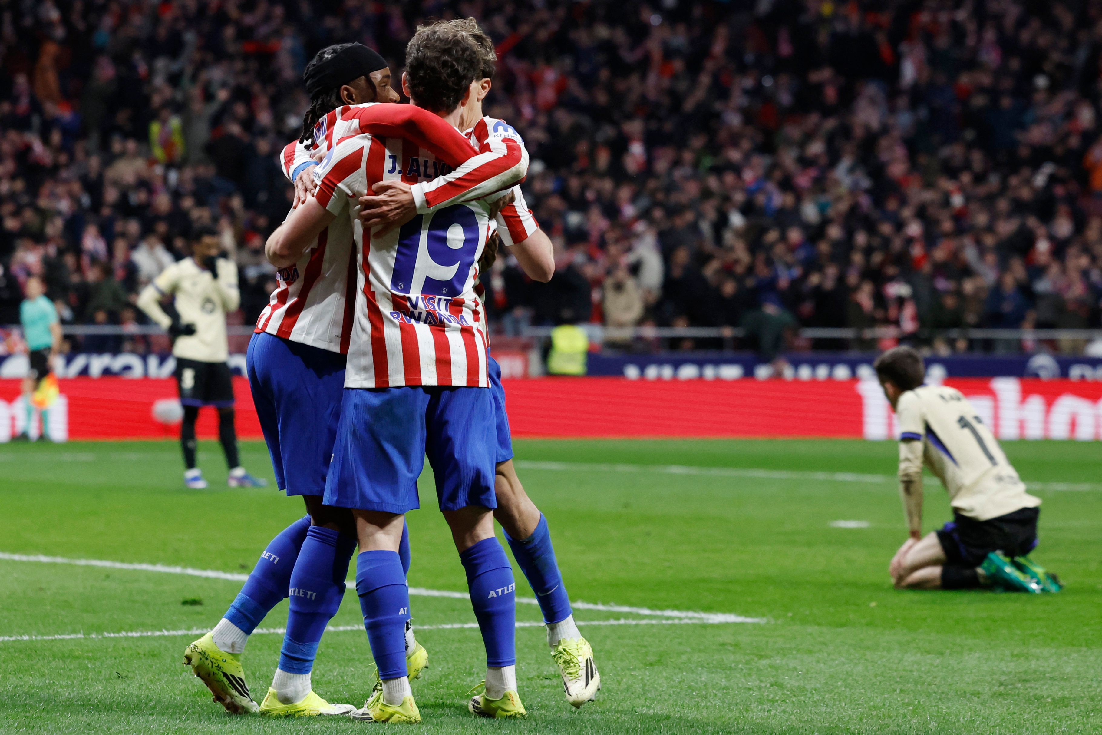 Atletico Madrid's English forward #22 Ademola Lookman (L) celebrates scoring his team's third goal during the Spanish Copa del Rey (King's Cup) semi final first leg football match between Club Atletico de Madrid and FC Barcelona at Metropolitano Stadium in Madrid on February 12, 2026. (Photo by Oscar DEL POZO / AFP)