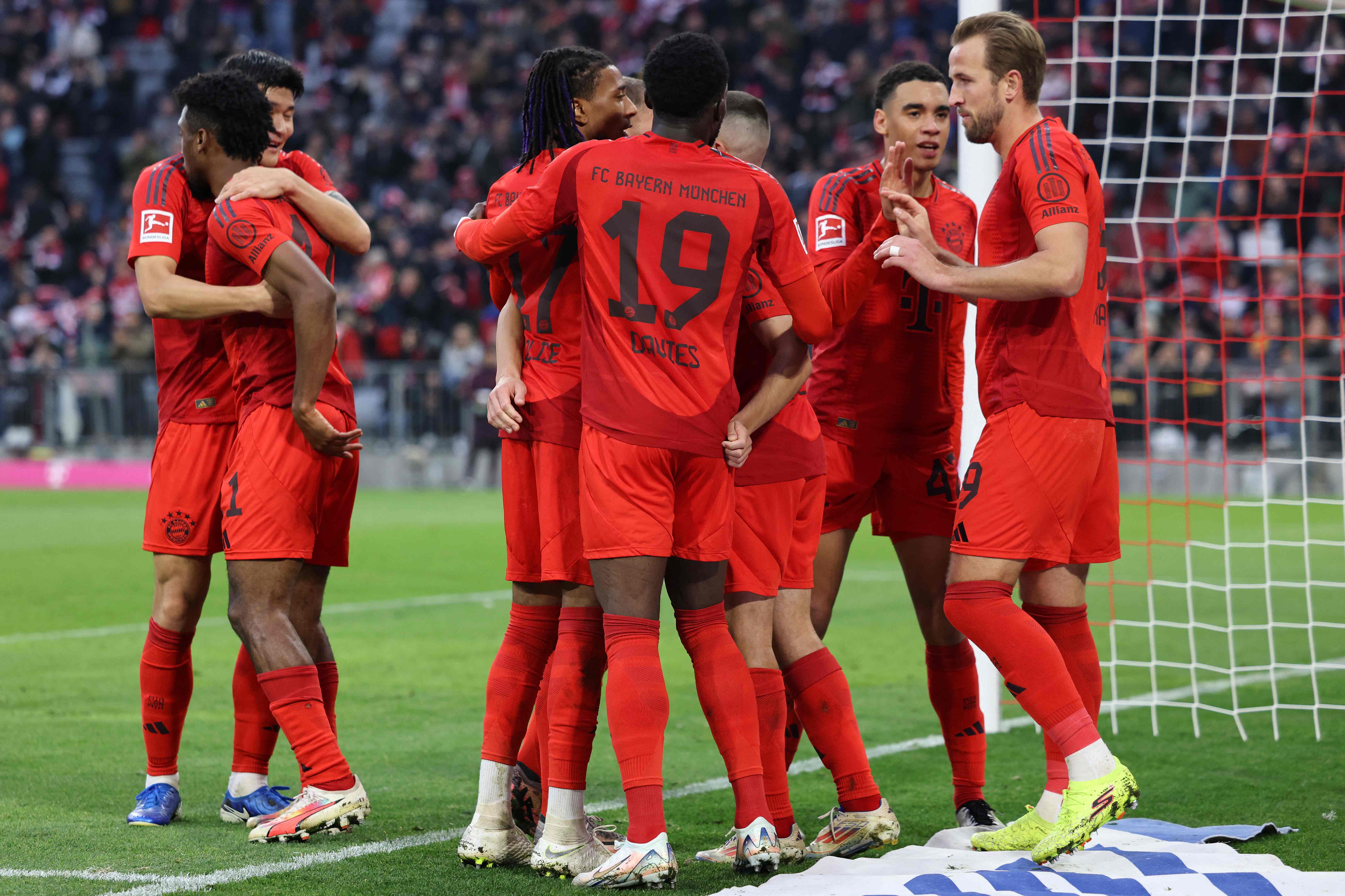 Bayern Munich's French forward #11 Kingsley Coman (2nd L) celebrates scoring the 2-0 goal with his teammates during the German first division Bundesliga football match FC Bayern Munich vs 1 FC Union Berlin in Munich, southern Germany, on November 2, 2024. (Photo by Alexandra BEIER / AFP) / DFL REGULATIONS PROHIBIT ANY USE OF PHOTOGRAPHS AS IMAGE SEQUENCES AND/OR QUASI-VIDEO