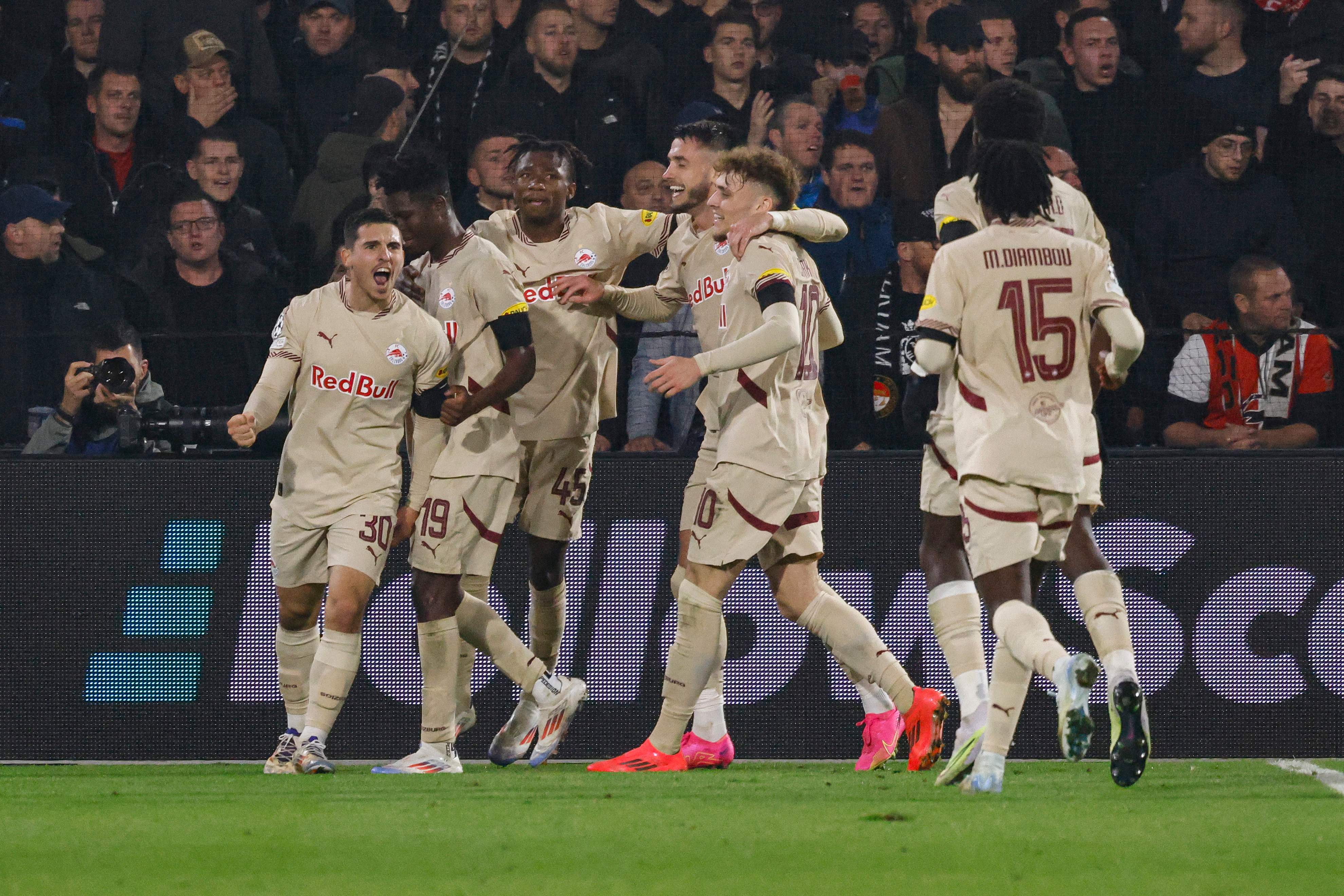 Salzburg's Ivorian forward #19 Karim Konate (2nd R) celebrates with teammates after scoring his team's first goal during the UEFA Champions League, League phase - Matchday 4, football match between Feyenoord and RB Salzburg, at the Feyenoord Stadium in Rotterdam, on November 6, 2024. (Photo by SIMON WOHLFAHRT / AFP)