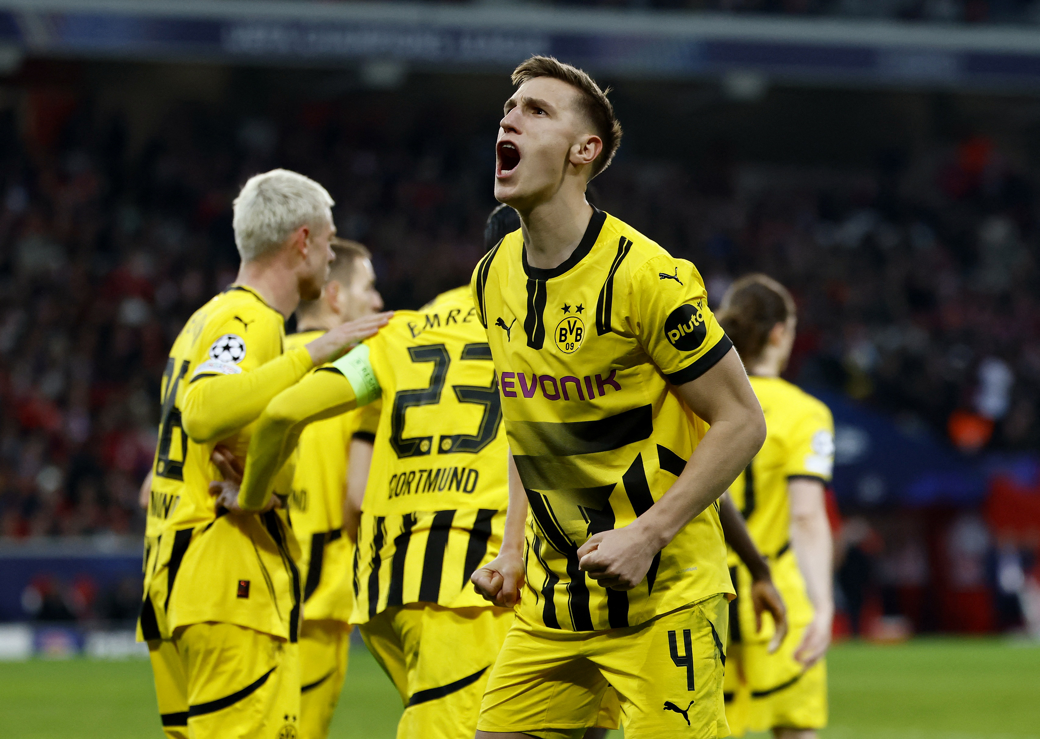 Soccer Football - Champions League - Round of 16 - Second Leg - Lille v Borussia Dortmund - Decathlon Arena Stade Pierre-Mauroy, Villeneuve-d'Ascq, France - March 12, 2025 Borussia Dortmund's Nico Schlotterbeck celebrates their first goal scored by Emre Can REUTERS/Stephanie Lecocq