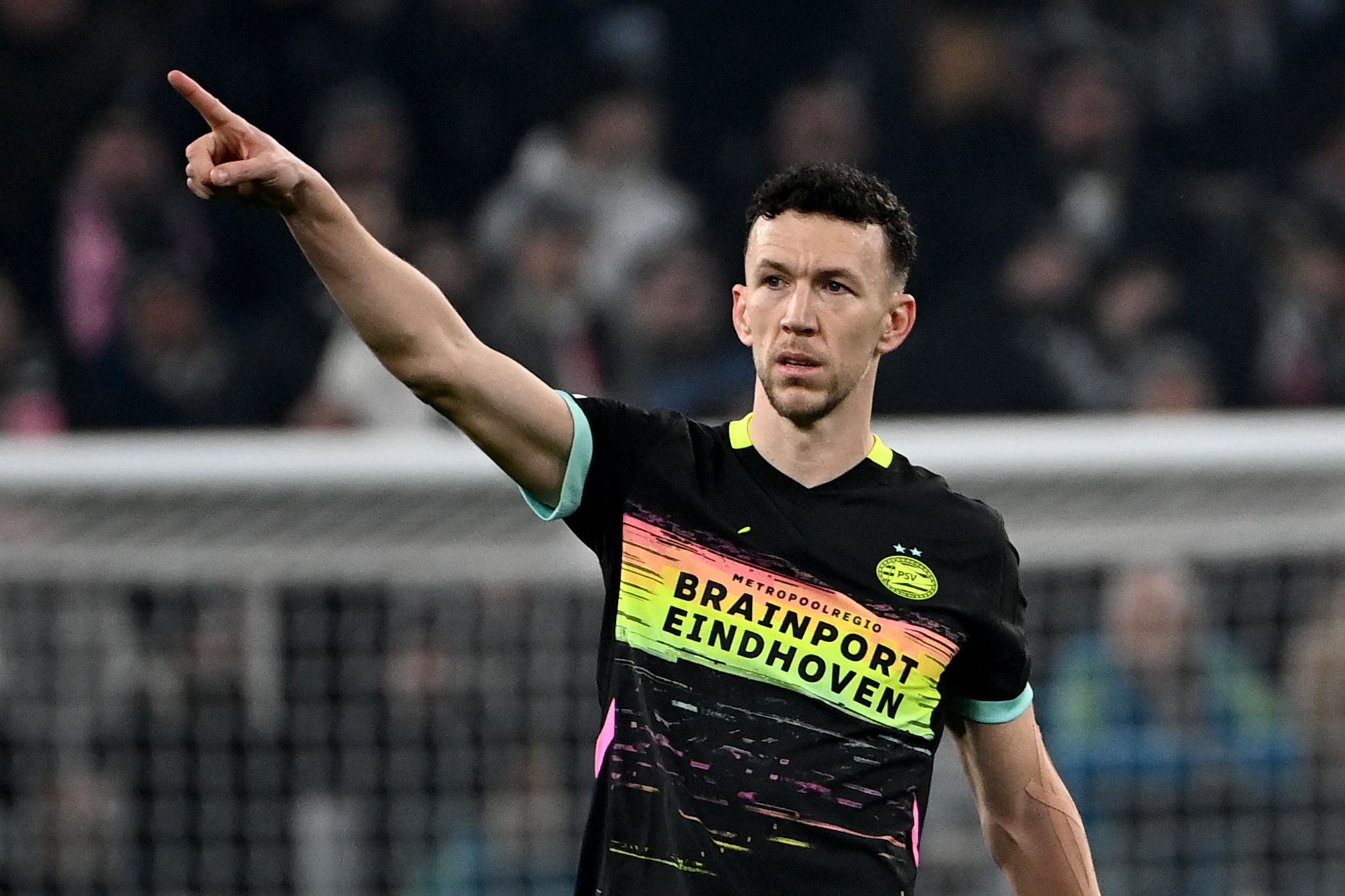 PSV Eindhoven's Croatian forward #05 Ivan Perisic celebrates scoring his team's first goal during the UEFA Champions League knockout phase play-off 1st leg football match between Juventus and PSV Eindhoven at the Allianz stadium in Turin, on February 11, 2025. (Photo by Isabella BONOTTO / AFP)