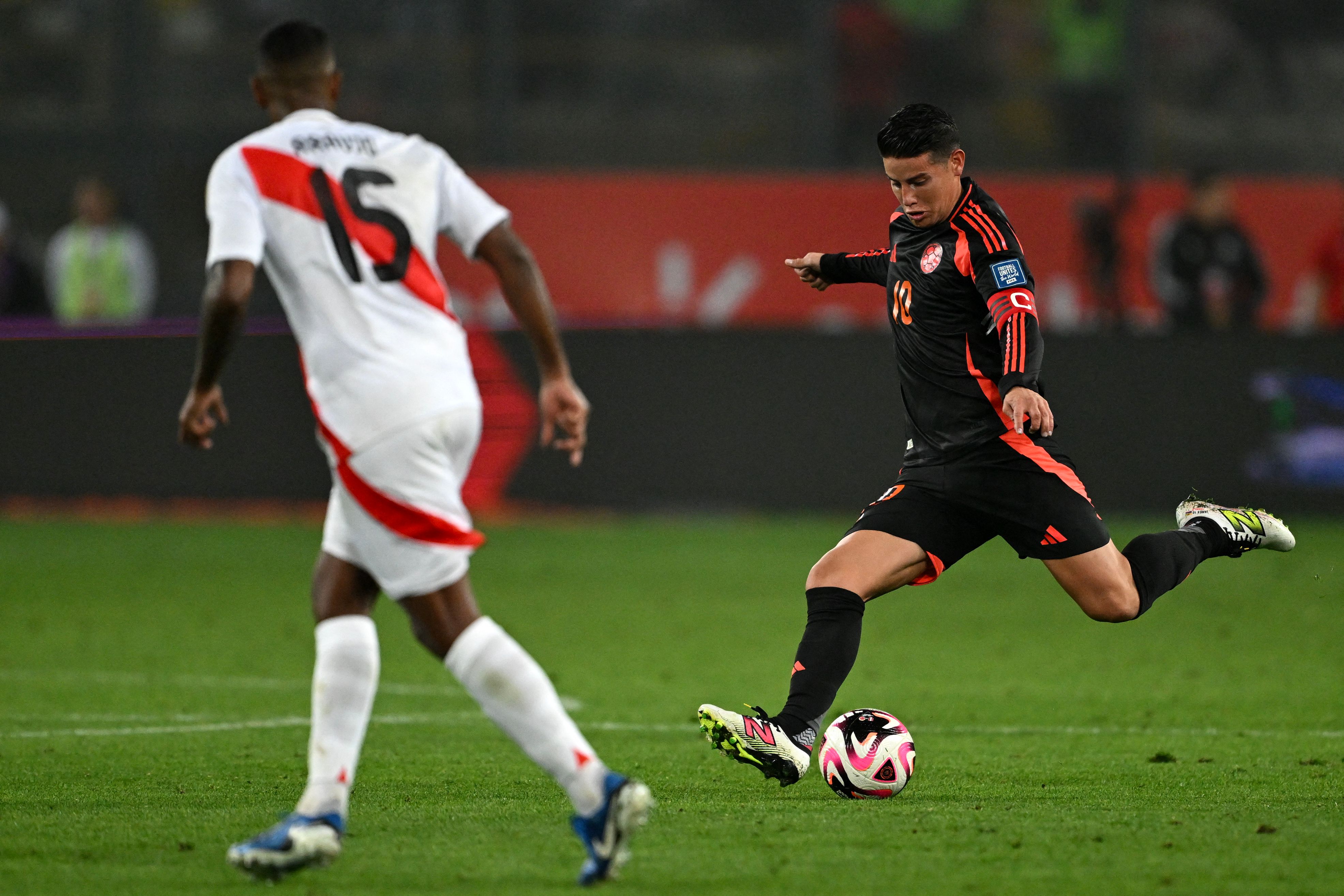 Colombia's midfielder James Rodriguez (R) controls the ball next to Peru's defender Miguel Araujo during the 2026 FIFA World Cup South American qualifiers football match between Peru and Colombia, at the Monumental stadium in Lima, on September 6, 2024. (Photo by ERNESTO BENAVIDES / AFP)