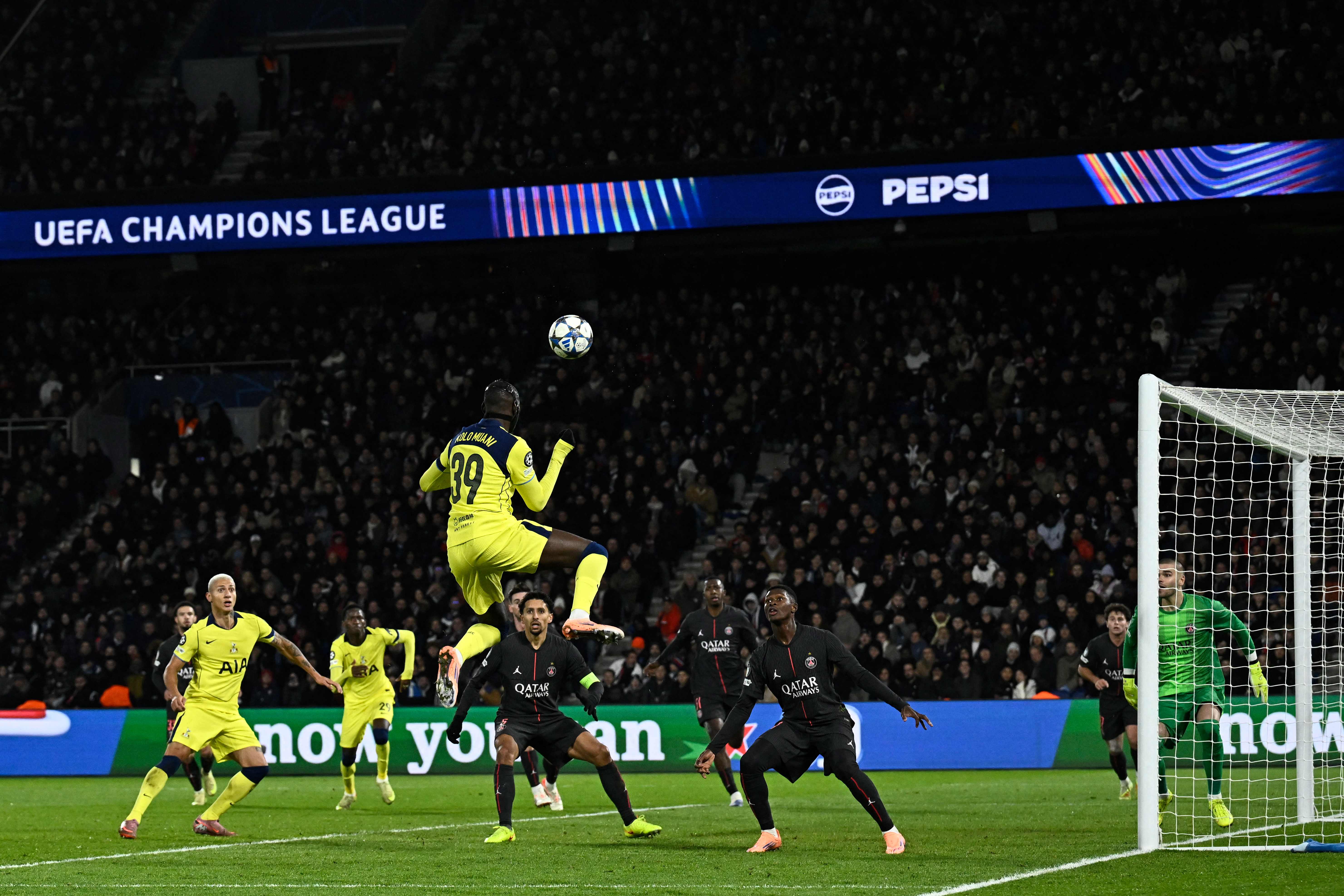 Tottenham's French forward #39 Randal Kolo Muani (C) heads the ball  during the UEFA Champions League, league phase - matchday 5, football match between Paris Saint-Germain (PSG) and Tottenham Hotspur FC at the Parc des Princes stadium in Paris on November 26, 2025. (Photo by JULIEN DE ROSA / AFP)