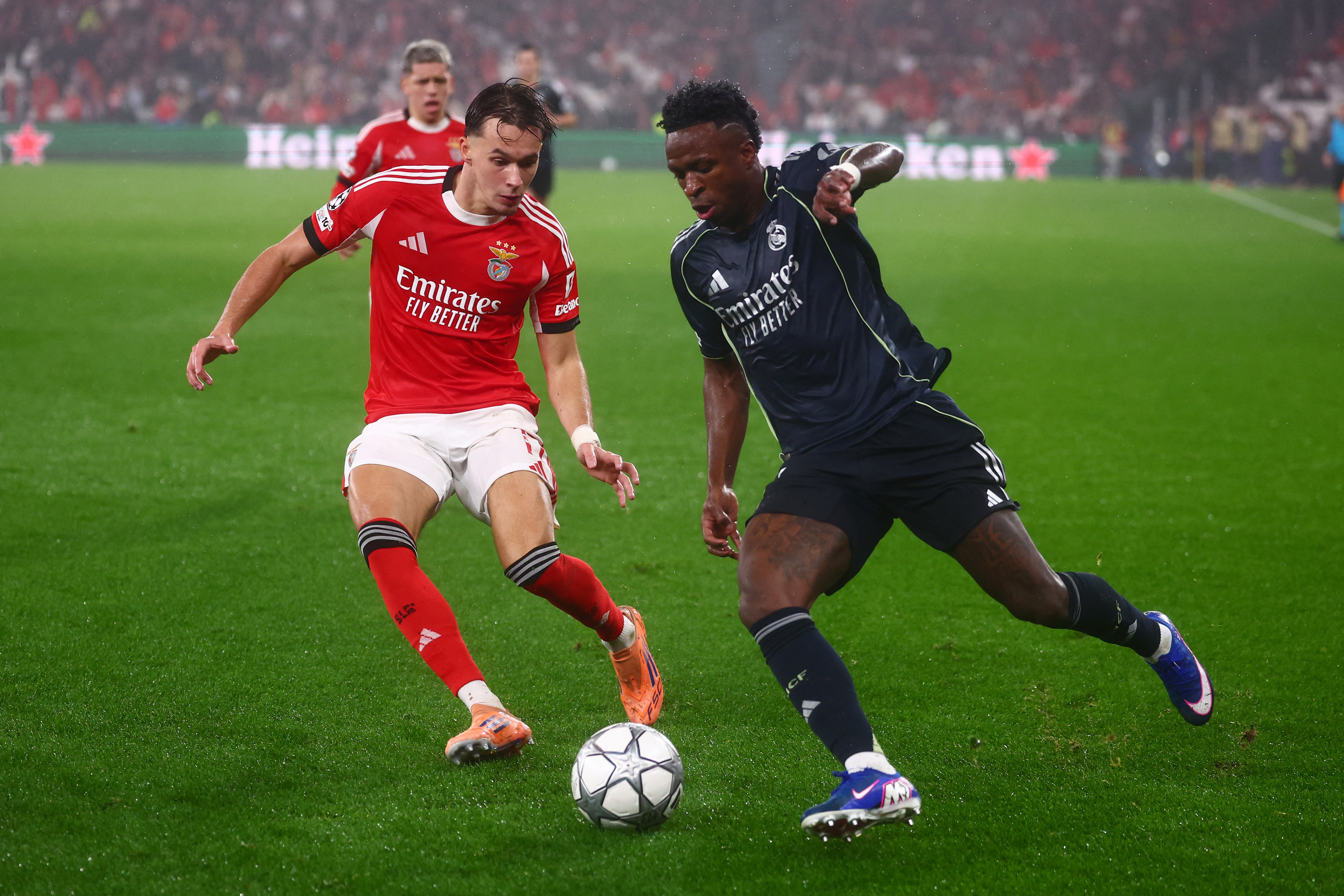 Soccer Football - UEFA Champions League - Benfica v Real Madrid - Estadio da Luz, Lisbon, Portugal - January 28, 2026 Benfica's Amar Dedic in action with Real Madrid's Vinicius Junior REUTERS/Pedro Nunes