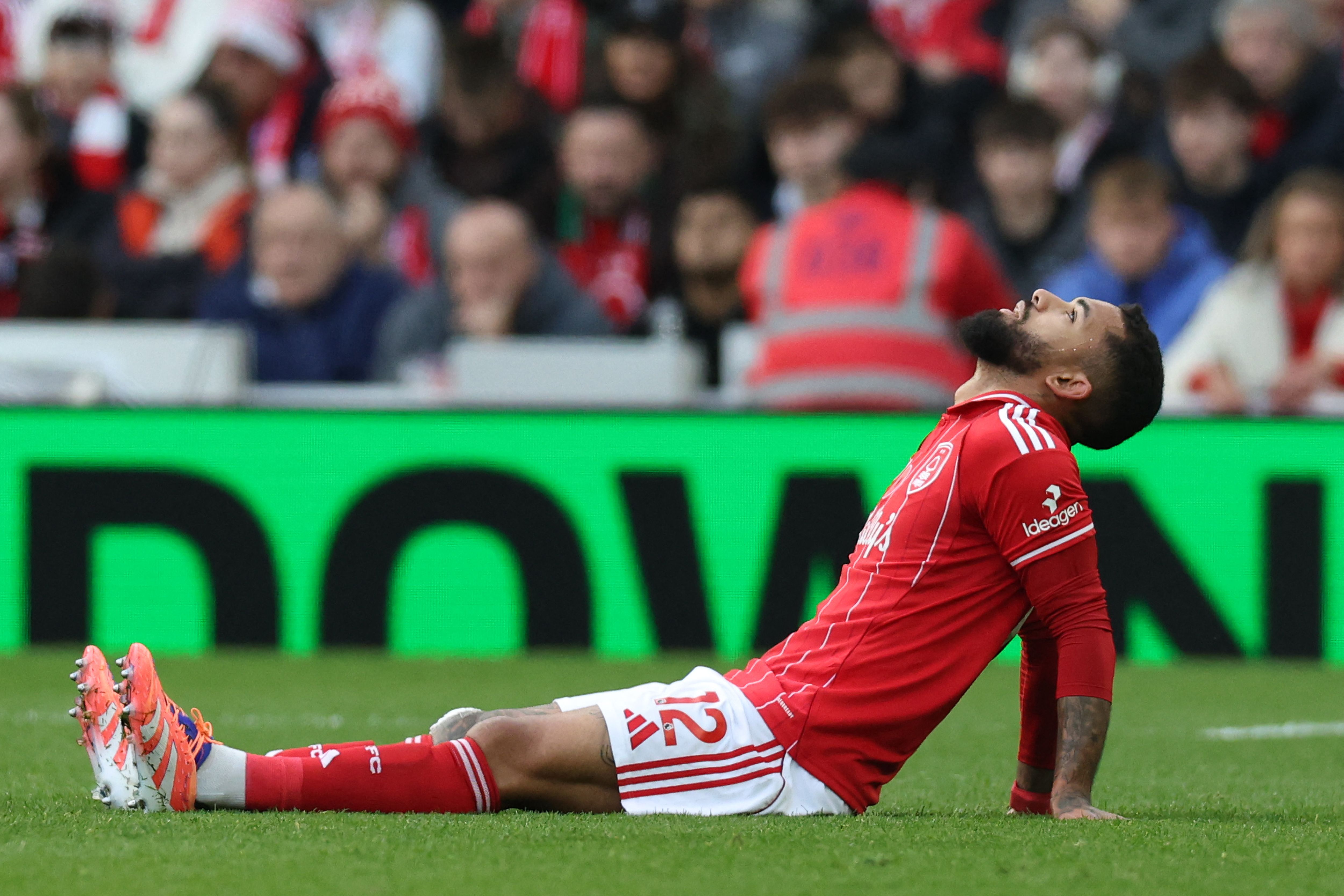 Nottingham Forest's Brazilian midfielder #12 Douglas Luiz reacts before leaving the pitch after being substituted off injured during the English Premier League football match between Nottingham Forest and Manchester United at The City Ground in Nottingham, central England, on November 1, 2025. (Photo by Darren Staples / AFP) / RESTRICTED TO EDITORIAL USE. No use with unauthorized audio, video, data, fixture lists, club/league logos or 'live' services. Online in-match use limited to 120 images. An additional 40 images may be used in extra time. No video emulation. Social media in-match use limited to 120 images. An additional 40 images may be used in extra time. No use in betting publications, games or single club/league/player publications. / 