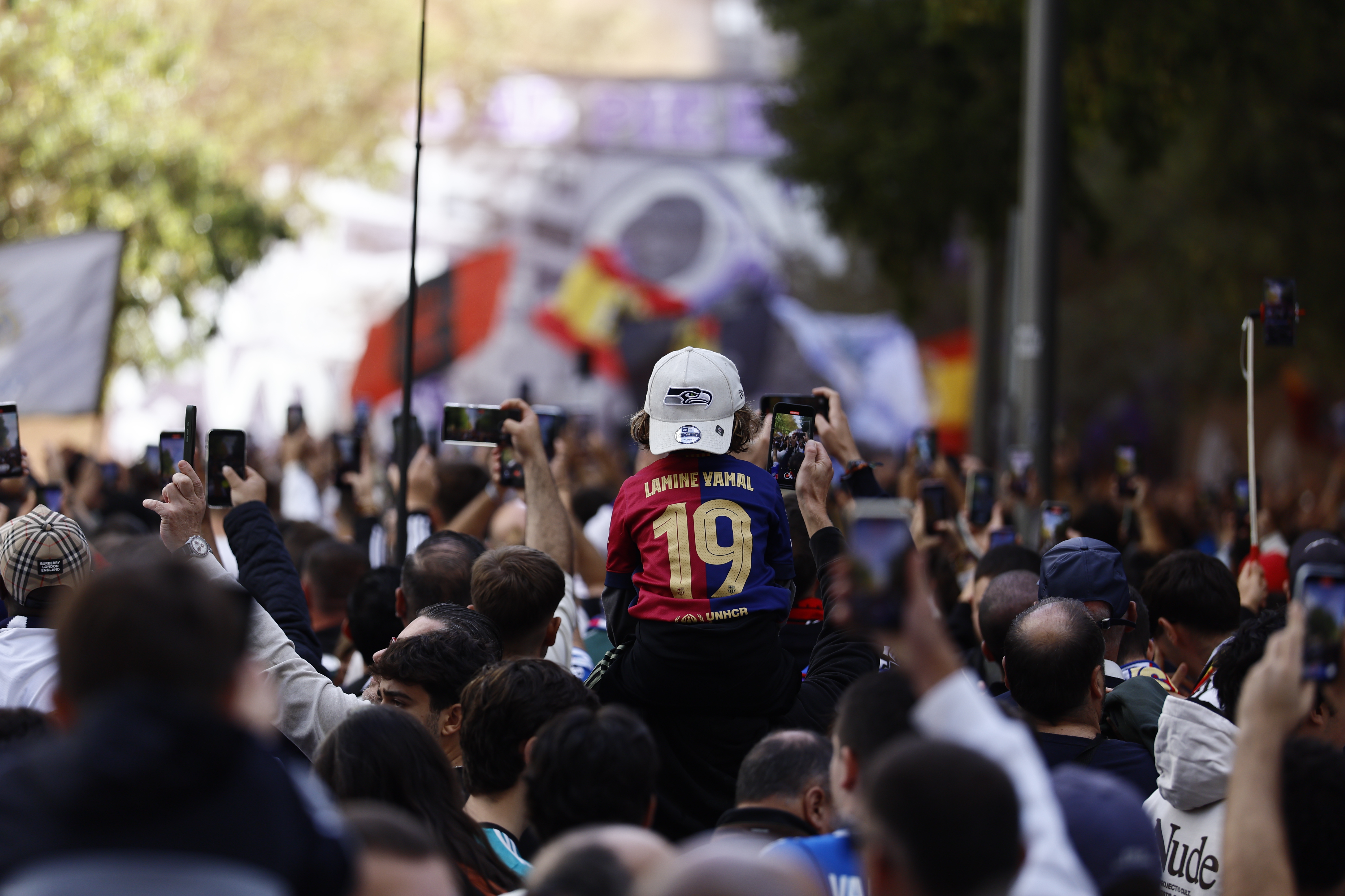 Supporters arrive at the Santiago Bernabeu for the first El Clasico fixture of the season.