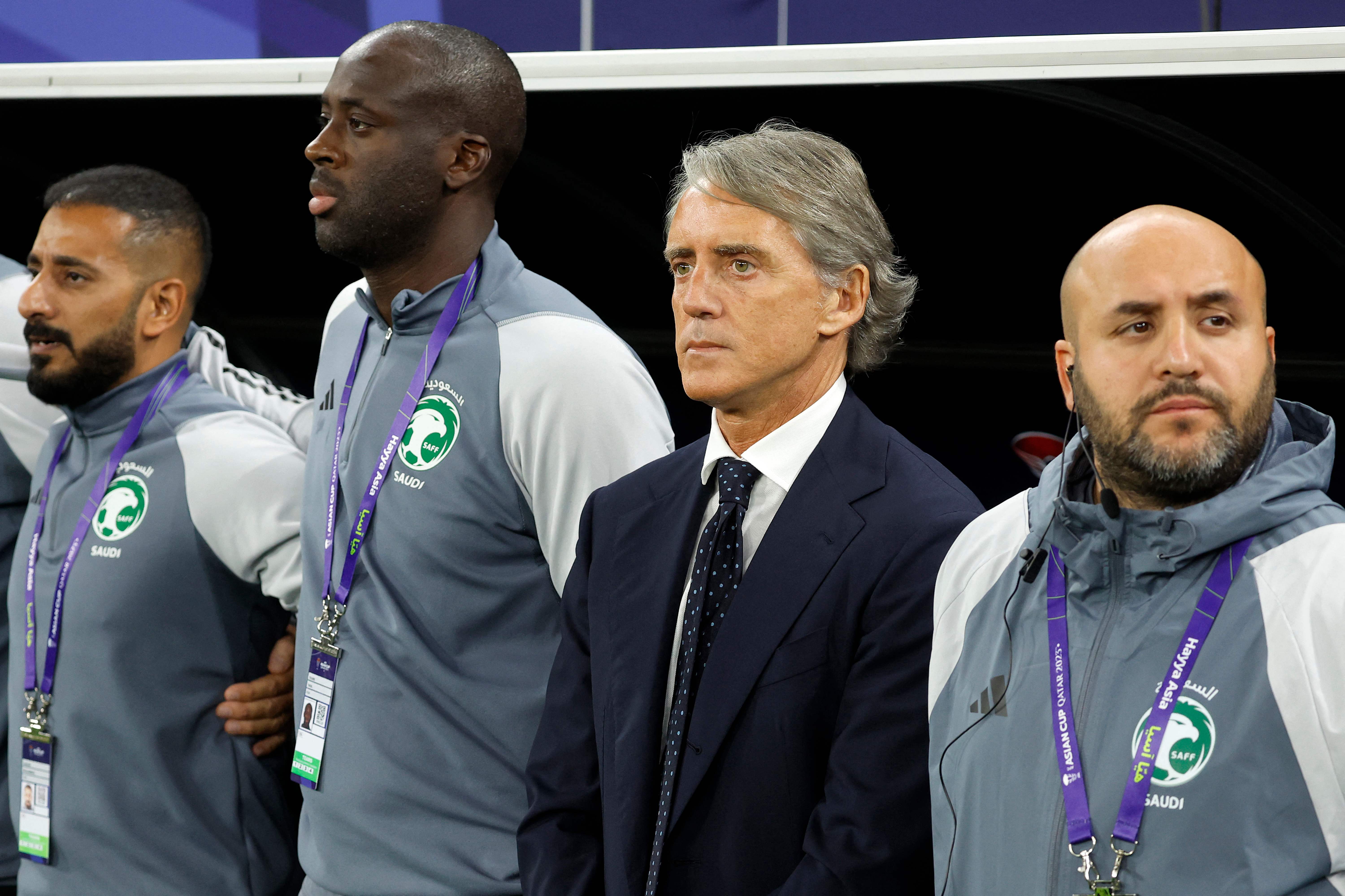 Saudi Arabia's Italian coach Roberto Mancini (2nd-R) looks on before the start of the Qatar 2023 AFC Asian Cup Group F football match between Kyrgyzstan and Saudi Arabia at the Ahmad Bin Ali Stadium in Al-Rayyan, west of Doha on January 21, 2024. (Photo by KARIM JAAFAR / AFP)