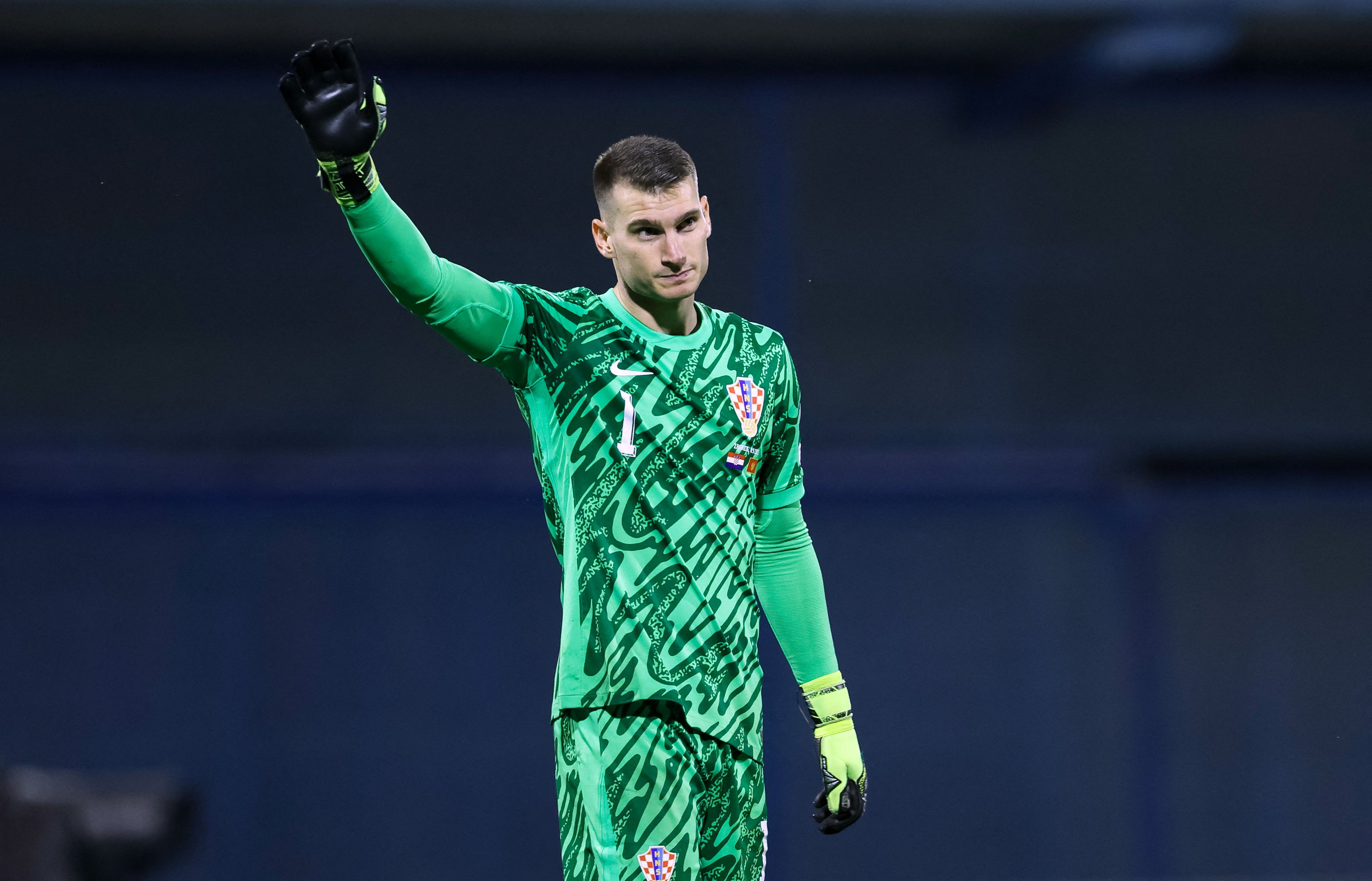 Croatia's goalkeeper #01 Dominik Livakovic celebrates victory after the FIFA World Cup 2026 Group L European qualification football match between Croatia and Montenegro at the Maksimir Stadium in Zagreb, on September 8, 2025. (Photo by DAMIR SENCAR / AFP)
