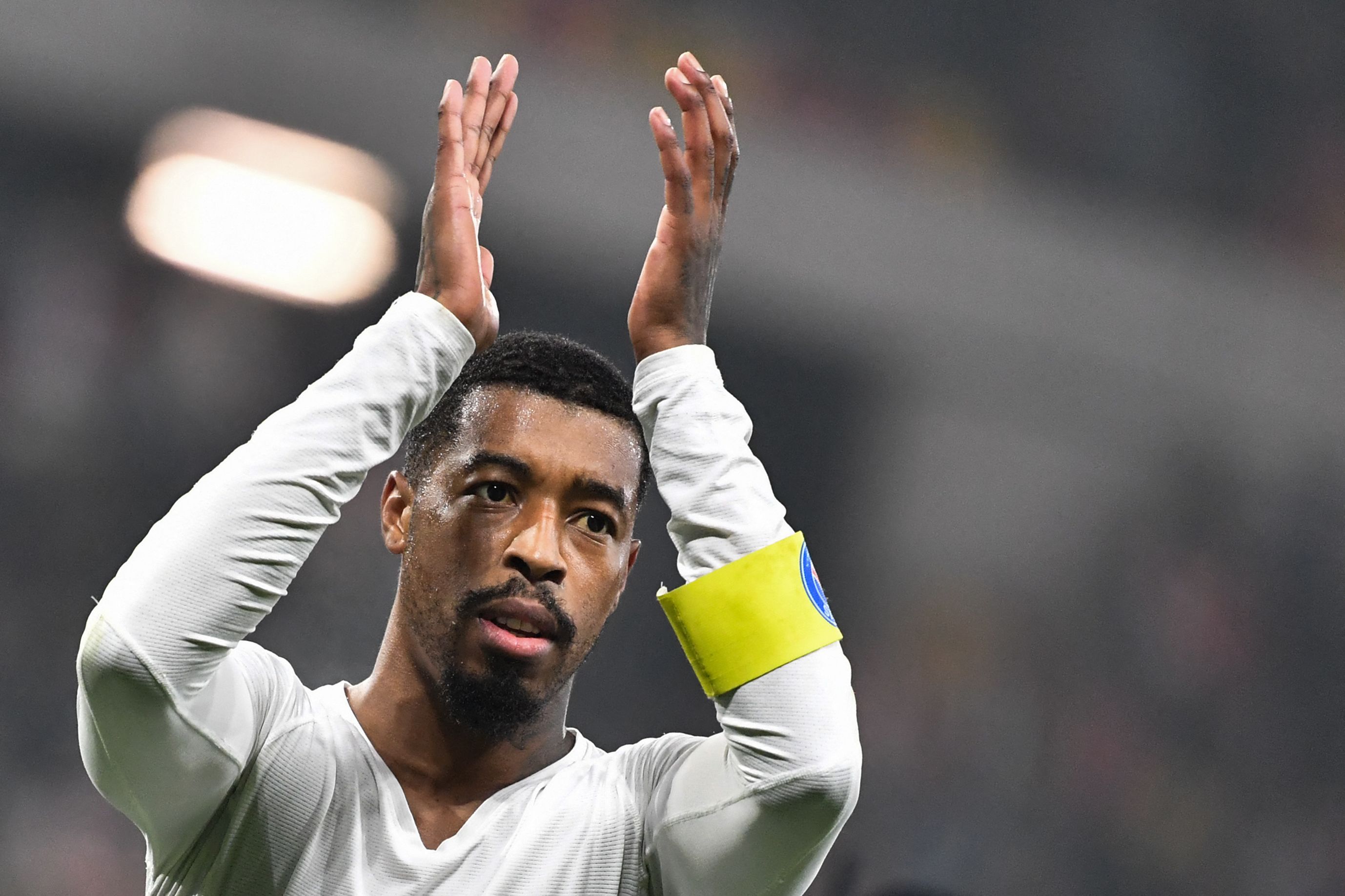 Paris Saint-Germain's French defender #13 Presnel Kimpembe applauses after winning the French Cup (Coupe de France) round of 16 football match between Le Mans FC and Paris Saint-Germain (PSG) at the Marie-Marvingt Stadium in Le Mans, western France, on February 4, 2025. (Photo by JEAN-FRANCOIS MONIER / AFP)