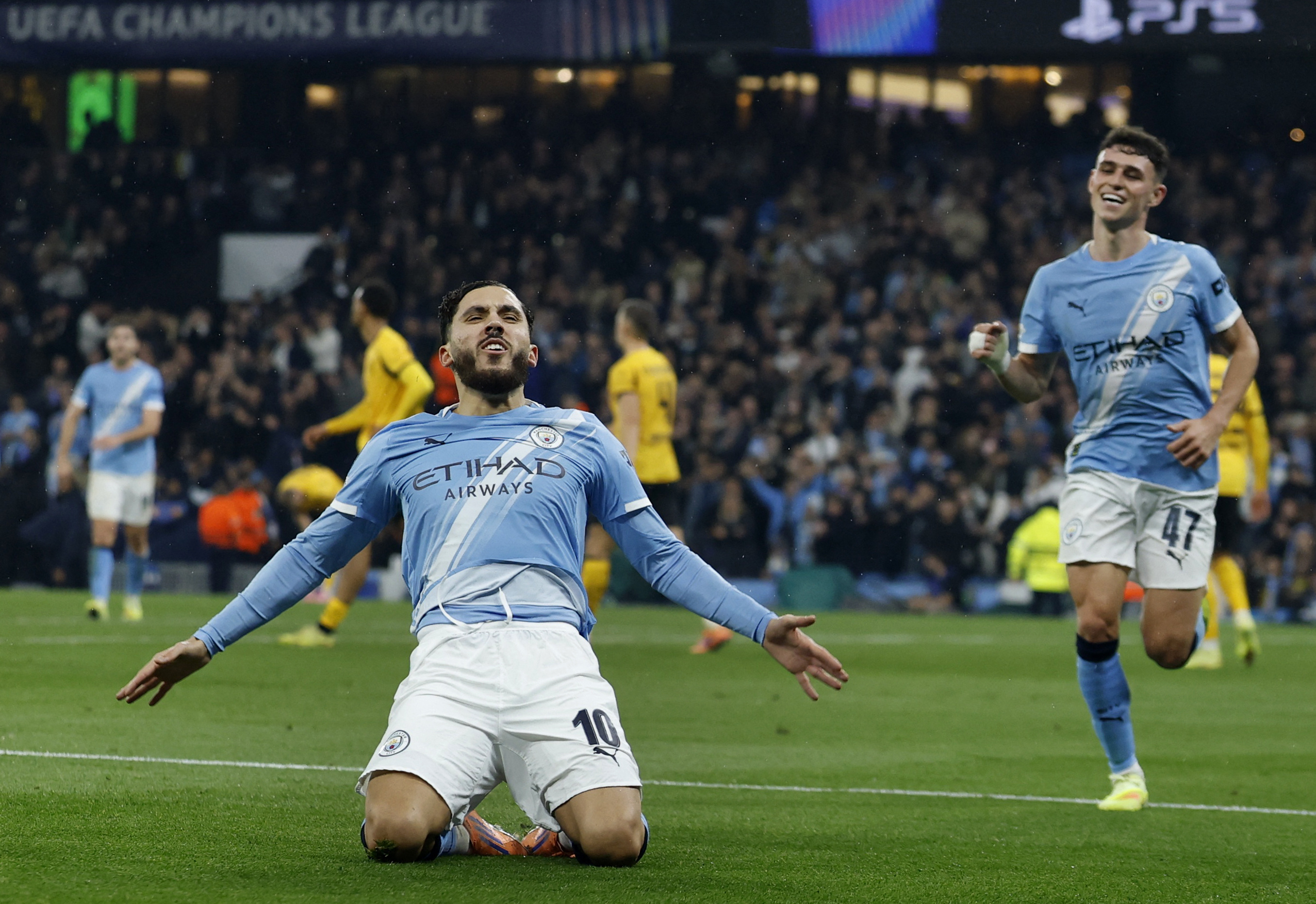 Soccer Football - UEFA Champions League - Manchester City v Borussia Dortmund - Etihad Stadium, Manchester, Britain - November 5, 2025 Manchester City's Rayan Cherki celebrates scoring their fourth goal with Phil Foden Action Images via Reuters/Jason Cairnduff