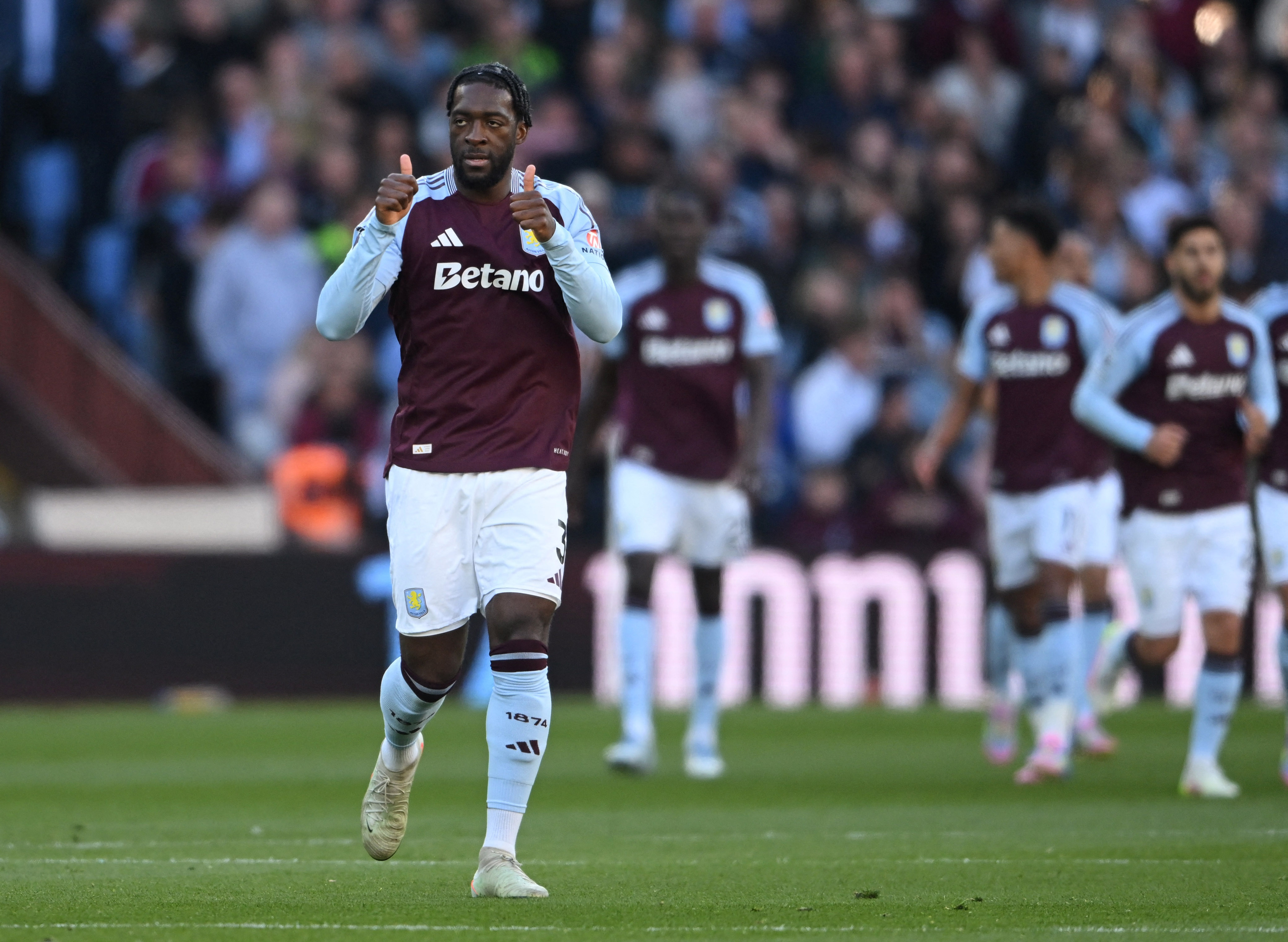 Soccer Football - Premier League - Aston Villa v Nottingham Forest - Villa Park, Birmingham, Britain - April 5, 2025 Aston Villa's Axel Disasi celebrates their second goal scored by Aston Villa's Donyell Malen REUTERS/Jaimi Joy EDITORIAL USE ONLY. NO USE WITH UNAUTHORIZED AUDIO, VIDEO, DATA, FIXTURE LISTS, CLUB/LEAGUE LOGOS OR 'LIVE' SERVICES. ONLINE IN-MATCH USE LIMITED TO 120 IMAGES, NO VIDEO EMULATION. NO USE IN BETTING, GAMES OR SINGLE CLUB/LEAGUE/PLAYER PUBLICATIONS. PLEASE CONTACT YOUR ACCOUNT REPRESENTATIVE FOR FURTHER DETAILS..