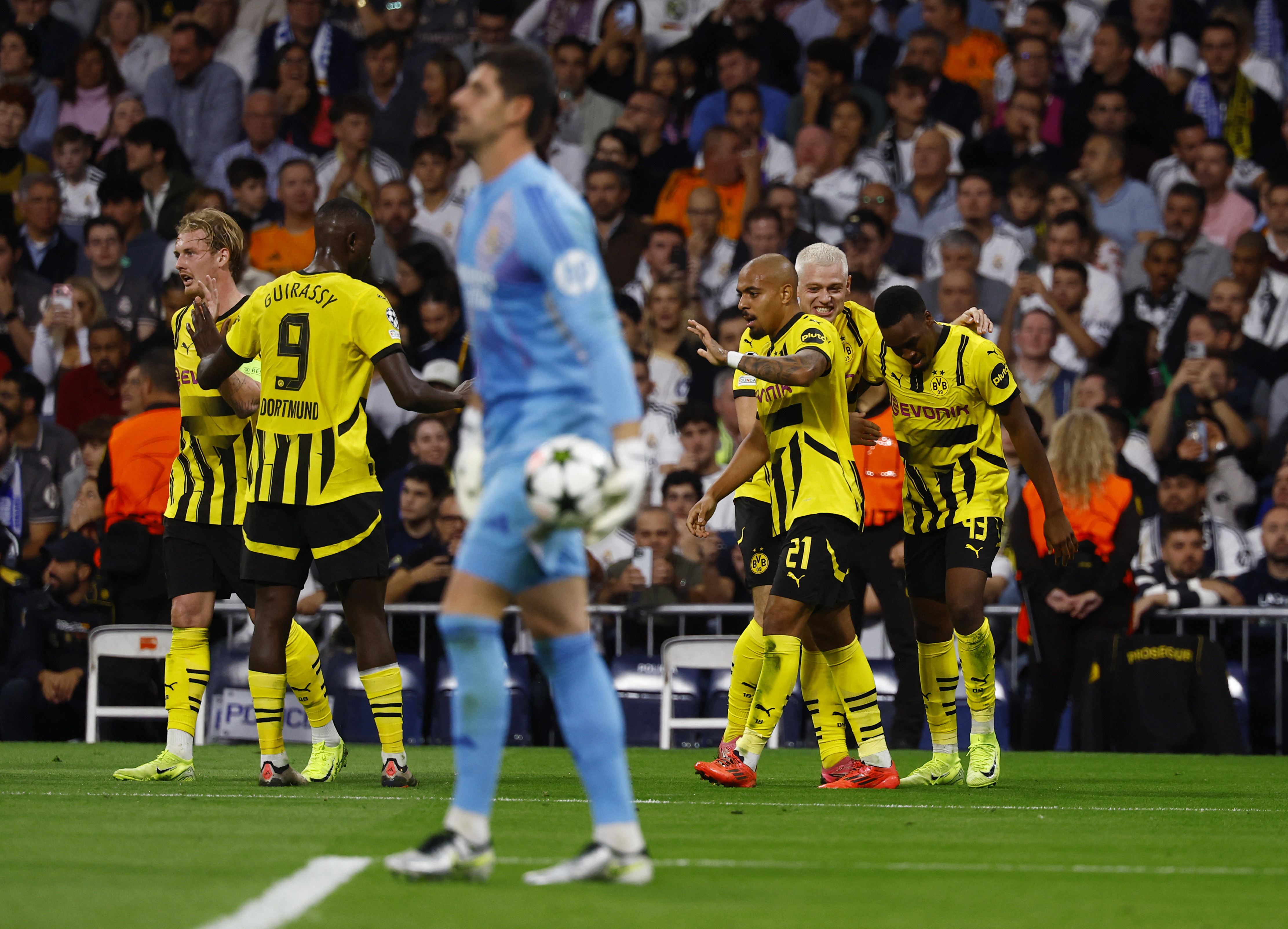 Soccer Football - Champions League - Real Madrid v Borussia Dortmund - Santiago Bernabeu, Madrid, Spain - October 22, 2024 Borussia Dortmund's Jamie Bynoe-Gittens celebrates scoring their second goal with teammates REUTERS/Susana Vera