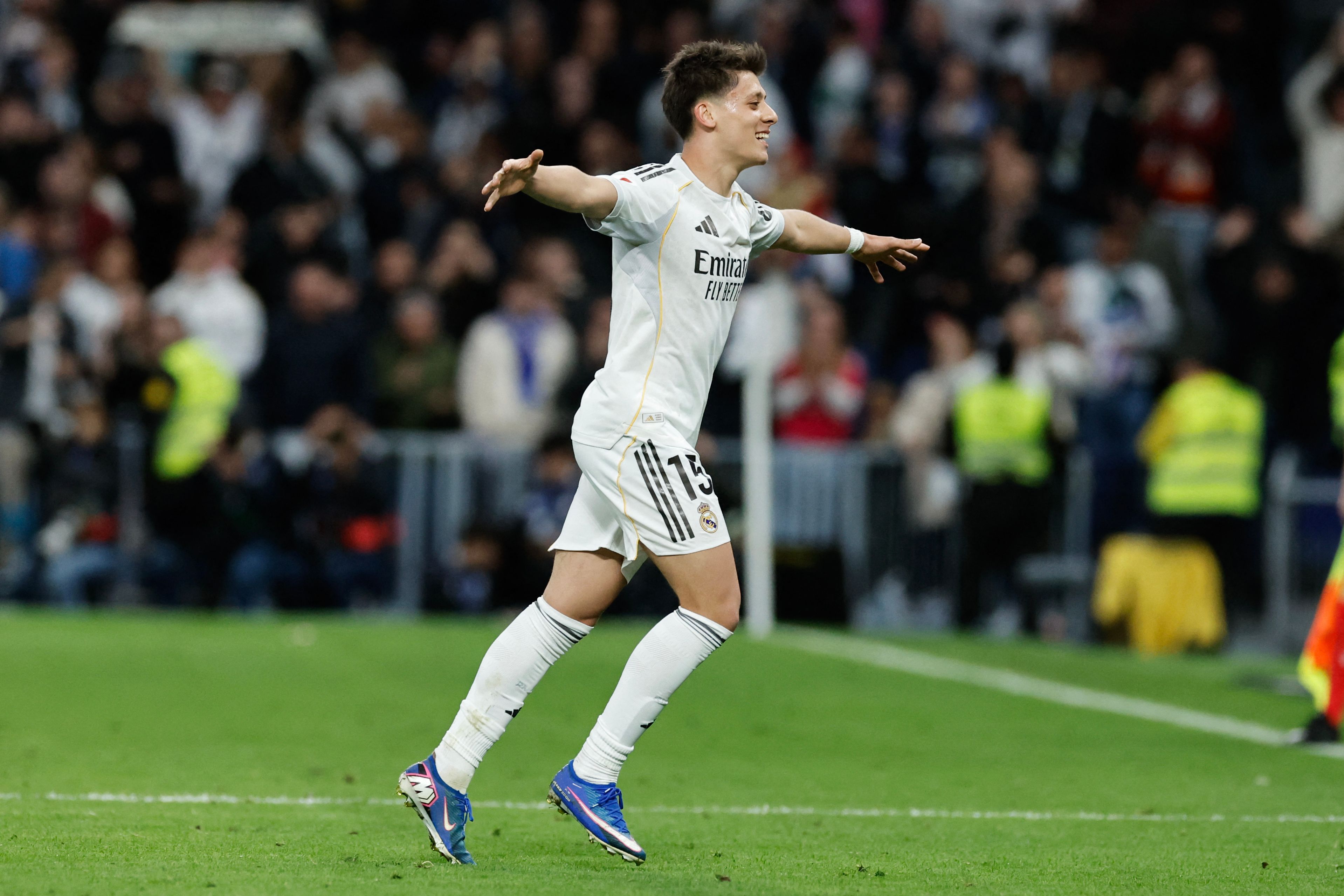 Real Madrid's Turkish midfielder #15 Arda Guler celebrates scoring his team's fourth goal during the Spanish league football match between Real Madrid CF and Elche CF at the Santiago Bernabeu Stadium in Madrid on March 14, 2026. (Photo by Oscar DEL POZO / AFP)