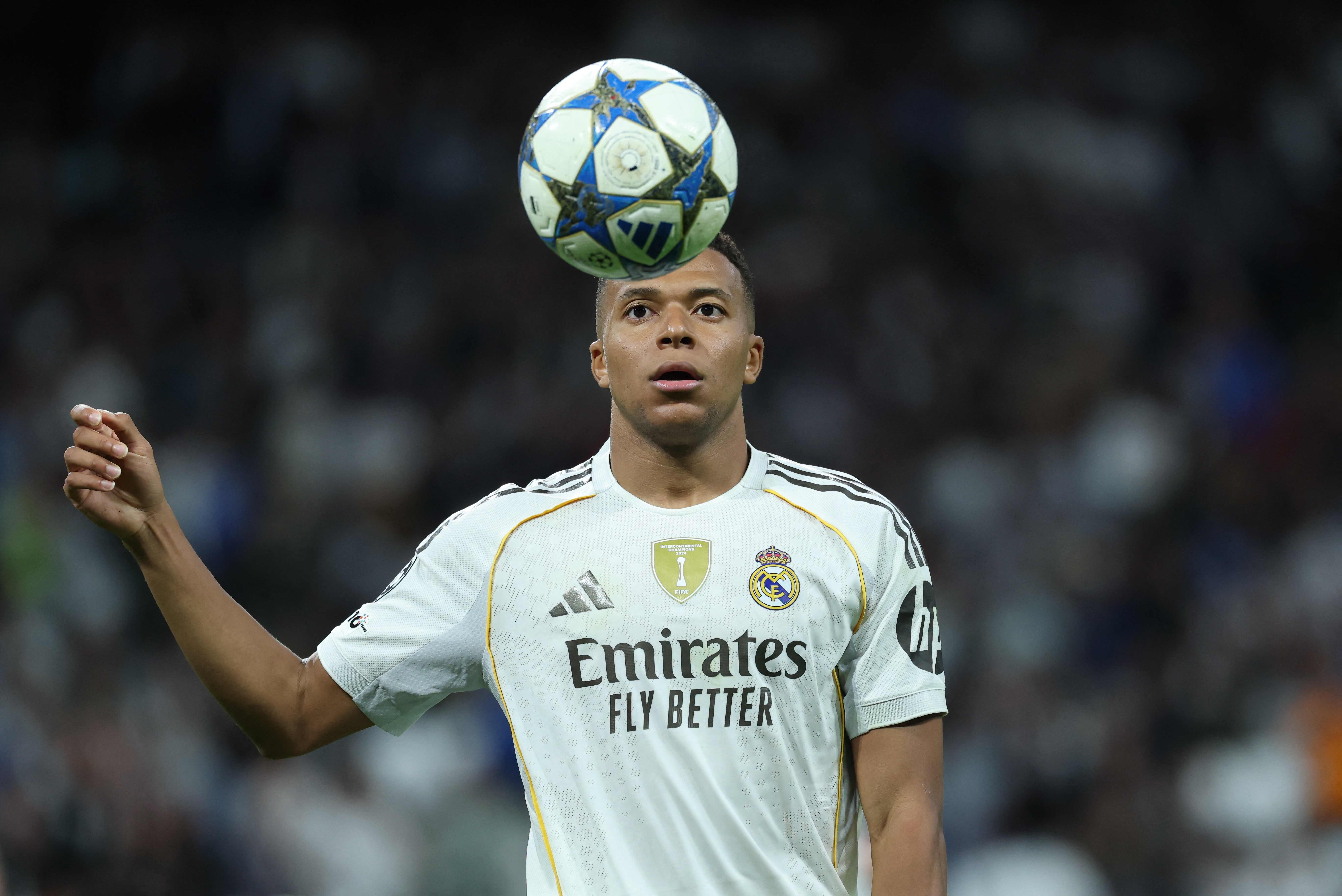 Real Madrid's French forward #10 Kylian Mbappe controls the ball during the UEFA Champions League league phase day 3 football match between Real Madrid CF and Juventus at Santiago Bernabeu Stadium in Madrid on October 22, 2025. (Photo by Thomas COEX / AFP)
