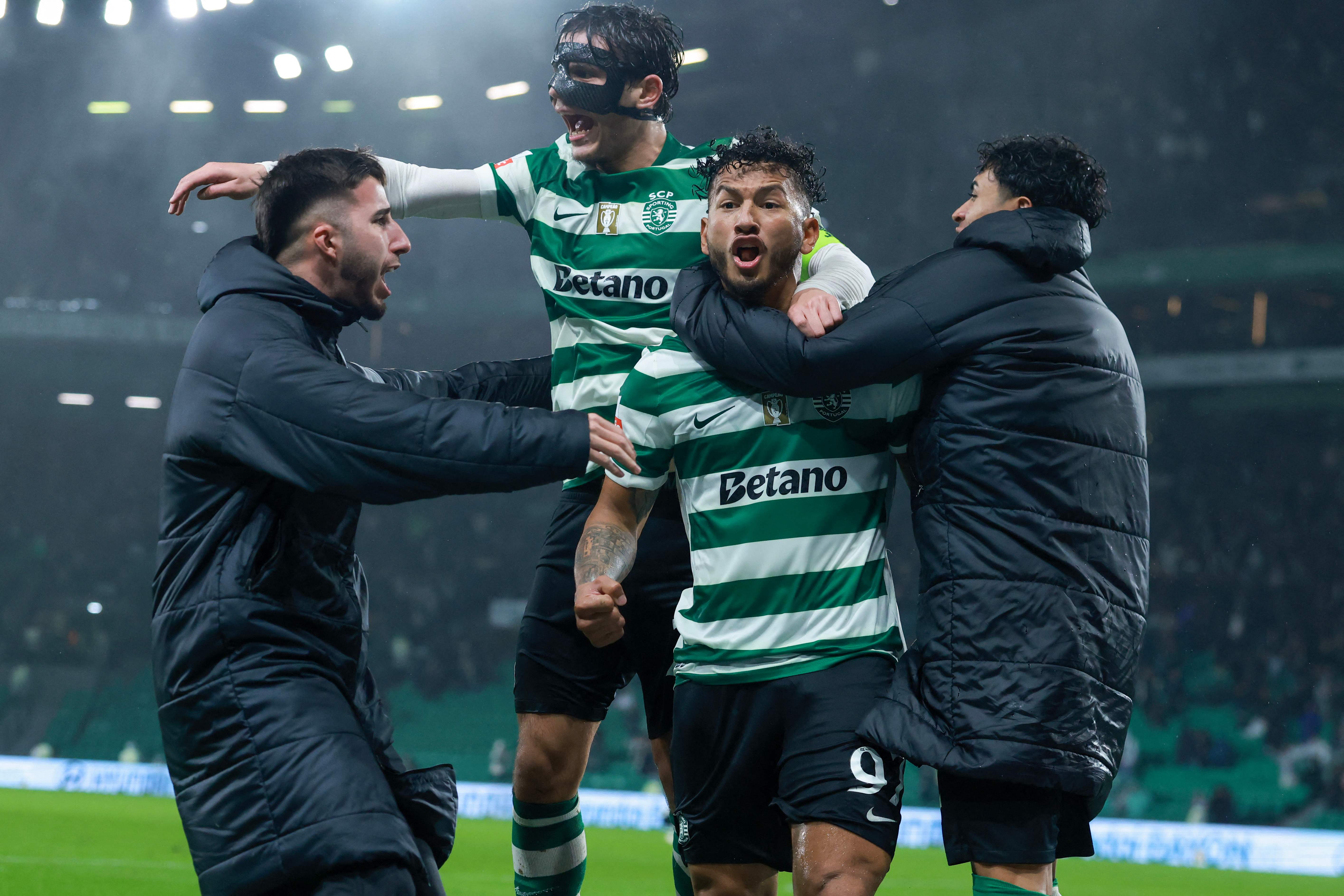 Sporting Lisbon's Colombian forward #97 Luis Suarez (C) celebrates scoring his team's second goal in extra time during the Portuguese League football match between Sporting CP and CD Nacional da Madeira at the Jose Alvalade stadium in Lisbon on February 1, 2026. Sporting won 2-1. (Photo by PATRICIA DE MELO MOREIRA / AFP)