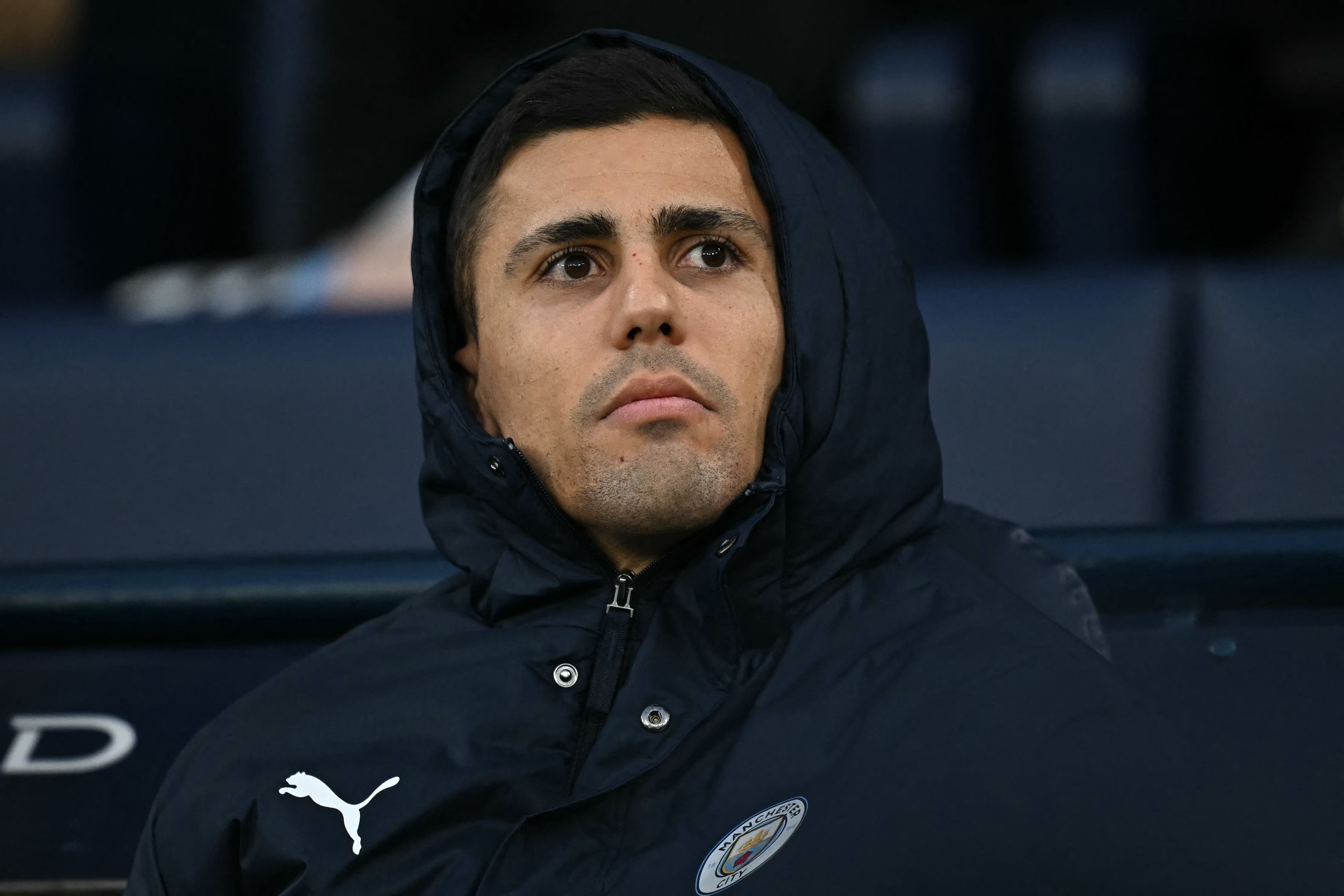Manchester City's Spanish midfielder #16 Rodri takes his place on the bench for the English Premier League football match between Manchester City and Bournemouth at the Etihad Stadium in Manchester, north west England, on November 2, 2025. (Photo by Paul ELLIS / AFP) / RESTRICTED TO EDITORIAL USE. No use with unauthorized audio, video, data, fixture lists, club/league logos or 'live' services. Online in-match use limited to 120 images. An additional 40 images may be used in extra time. No video emulation. Social media in-match use limited to 120 images. An additional 40 images may be used in extra time. No use in betting publications, games or single club/league/player publications. / 