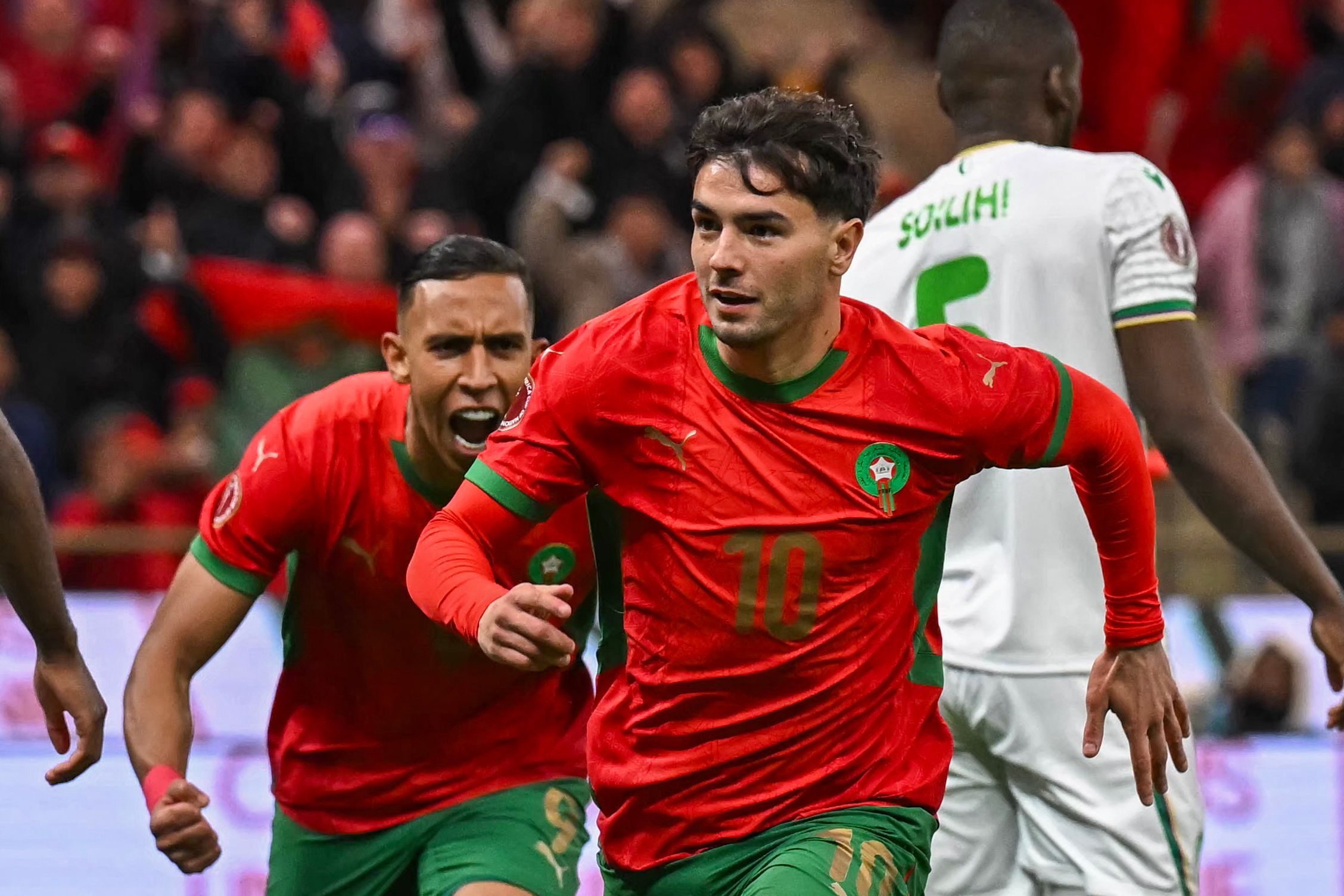 Morocco's forward #10 Brahim Diaz celebrates his goal during the Africa Cup of Nations (CAN) group A  football match between Morocco and Comoros at Prince Moulay Abdellah Stadium in Rabat on December 21, 2025. (Photo by Paul ELLIS / AFP)