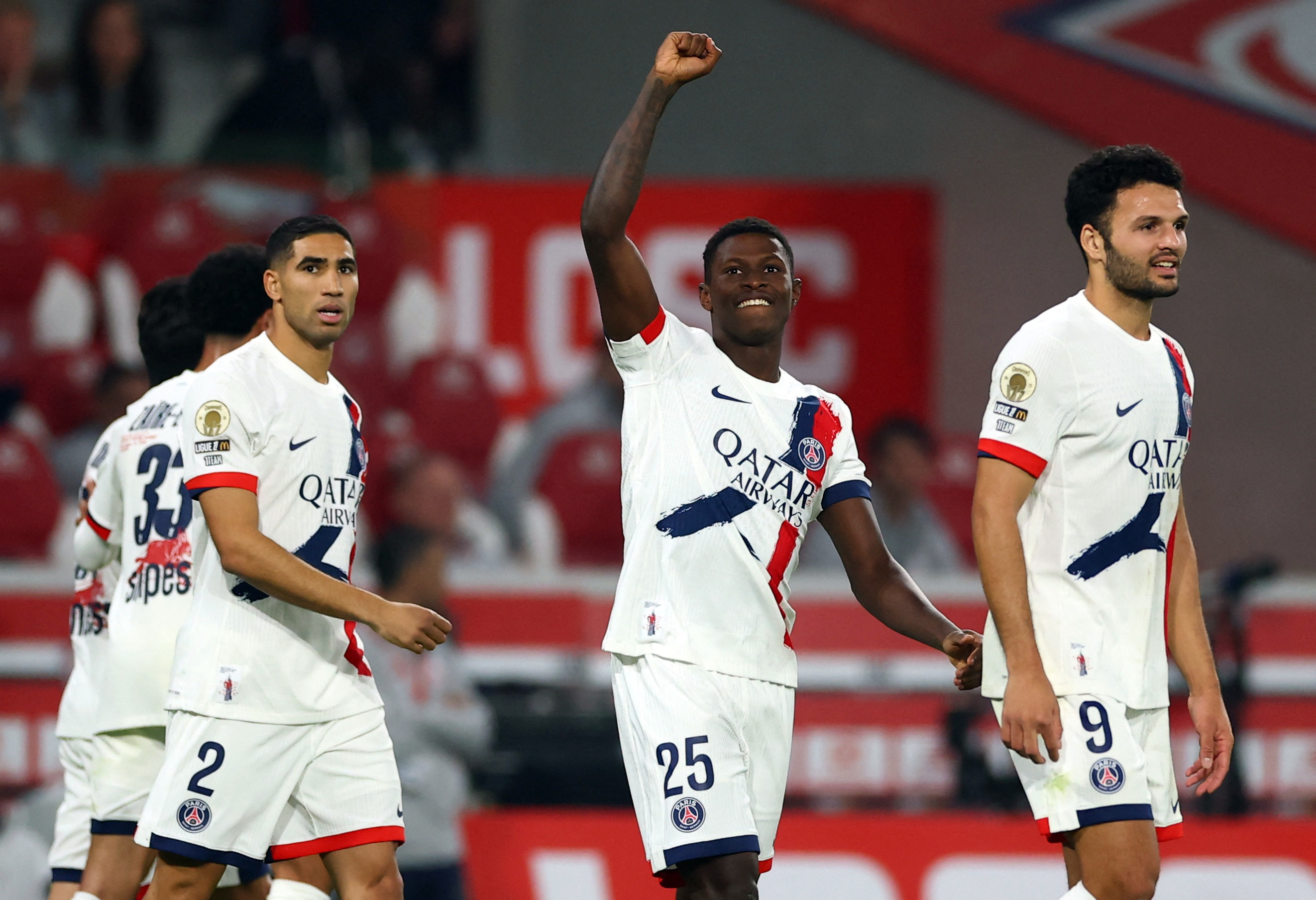 Soccer Football - Ligue 1 - Lille v Paris St Germain - Decathlon Arena Stade Pierre-Mauroy, Villeneuve-d'Ascq, France - October 5, 2025 Paris St Germain's Nuno Mendes celebrates scoring their first goal REUTERS/Gonzalo Fuentes
