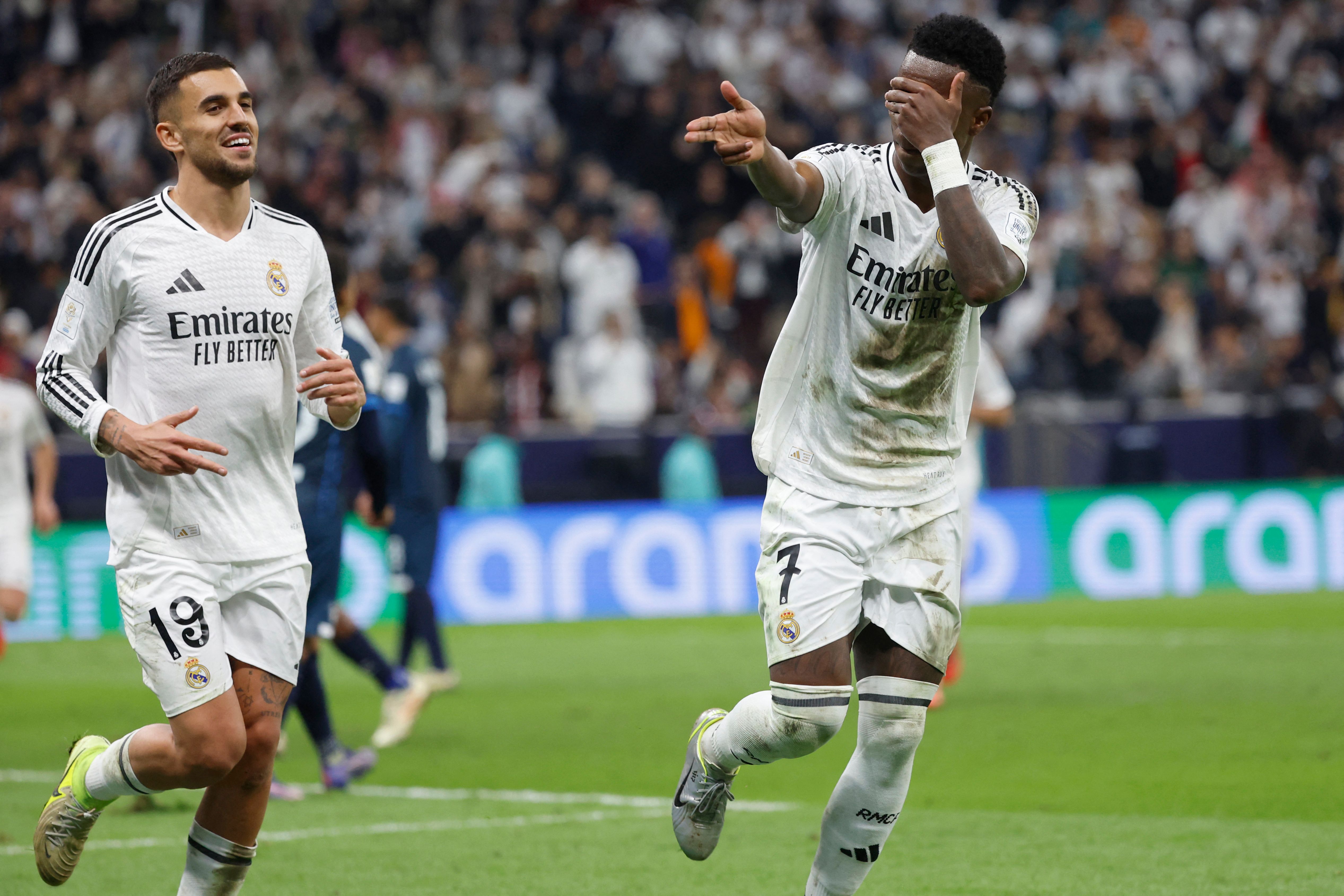 Real Madrid's Brazilian forward #7 Vinicius Junior celebrates after scoring his team's third goal from a penalty kick during the 2024 FIFA Intercontinental Cup final football match between Spain's Real Madrid and Mexico's Pachuca at the Lusail Stadium in Doha on December 18, 2024. (Photo by KARIM JAAFAR / AFP)