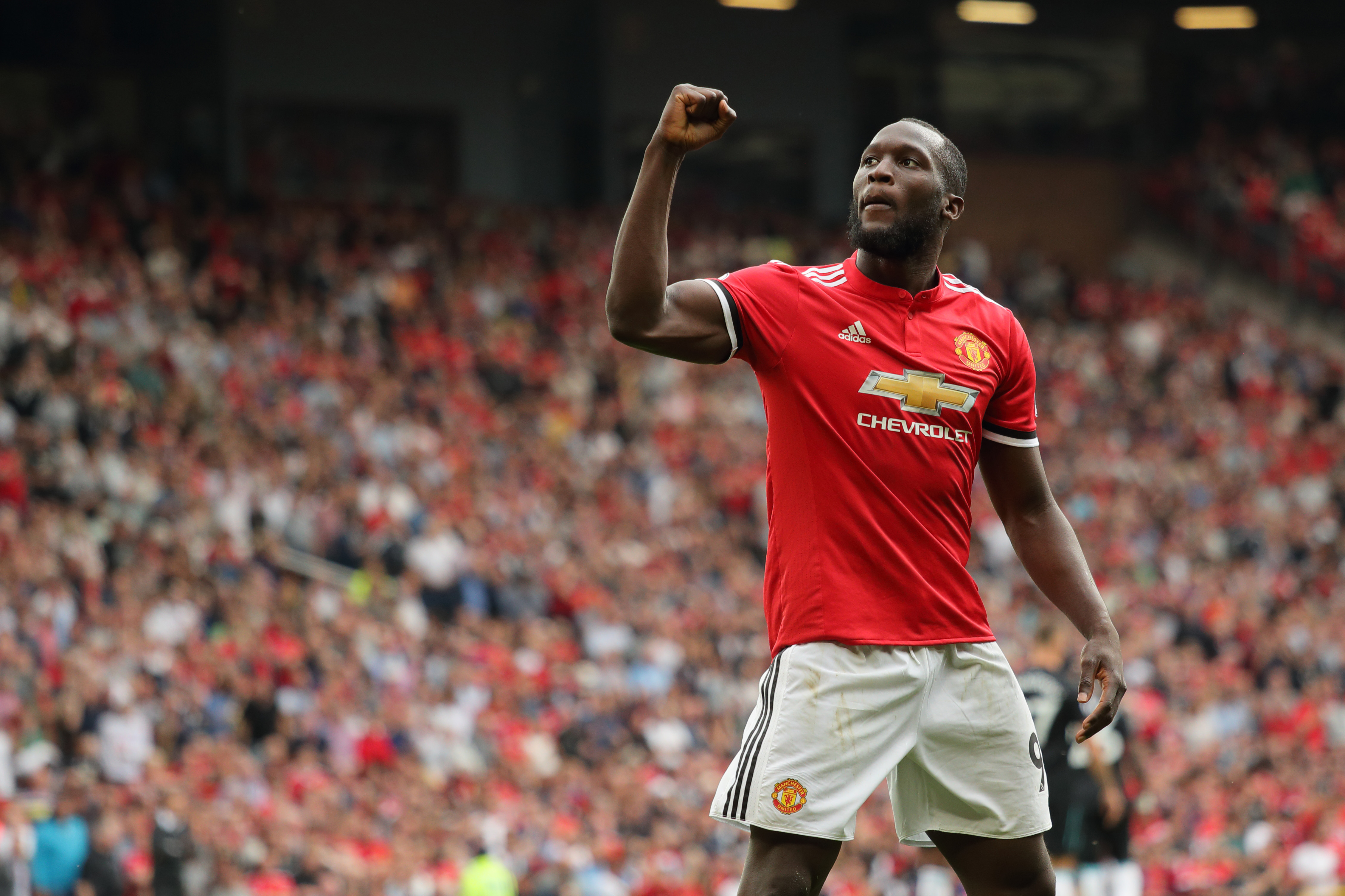 MANCHESTER, ENGLAND - AUGUST 13: Romelu Lukaku of Manchester United celebrates after scoring a goal to make it 2-0 during the Premier League match between Manchester United and West Ham United at Old Trafford on August 13, 2017 in Manchester, England. (Photo by Matthew Ashton - AMA/Getty Images)