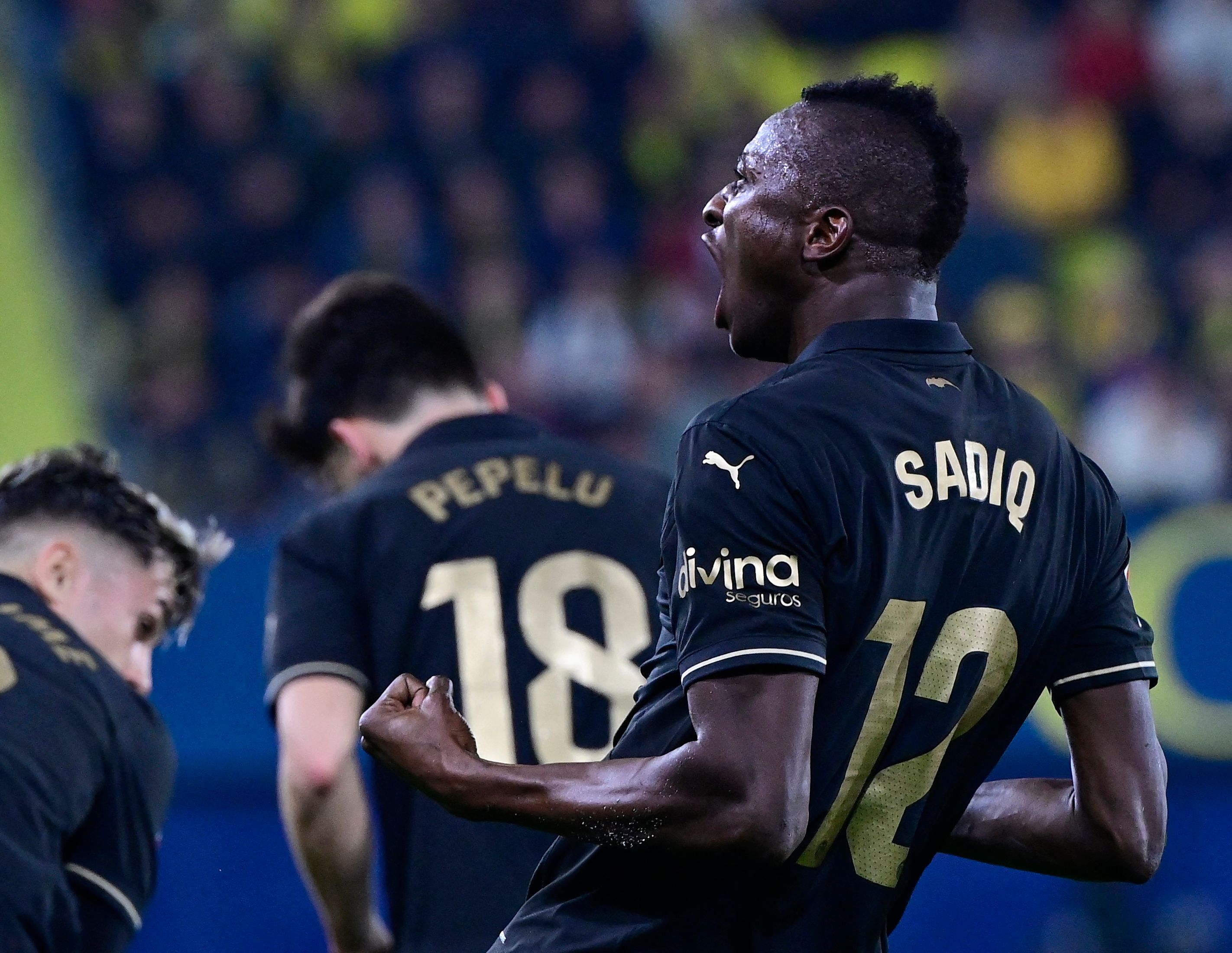 Valencia's Nigerian forward #12 Sadiq Umar reacts during the Spanish league football match between Villarreal CF and Valencia CF at La Ceramica Stadium in Vila-real on February 15, 2025. (Photo by JOSE JORDAN / AFP)