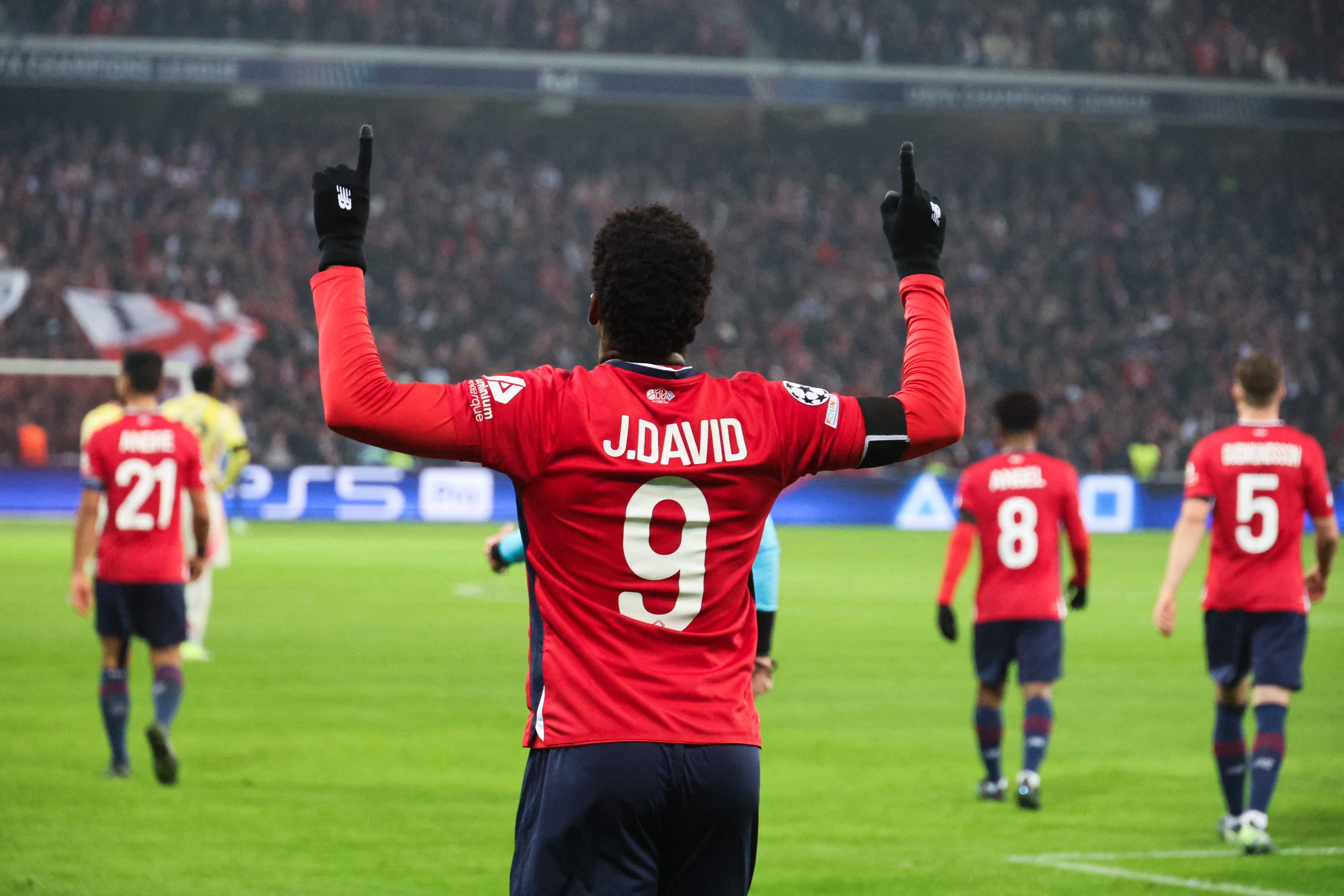 Lille's Canadian forward #09 Jonathan David celebrates after opening the scoring during the UEFA Champions League, League phase - Matchday 4 football match between Lille OSC (LOSC) and Juventus FC, at Stade Pierre Mauroy, in Villeneuve d'Ascq, northern France, on November 5, 2024. (Photo by Francois LO PRESTI / AFP)