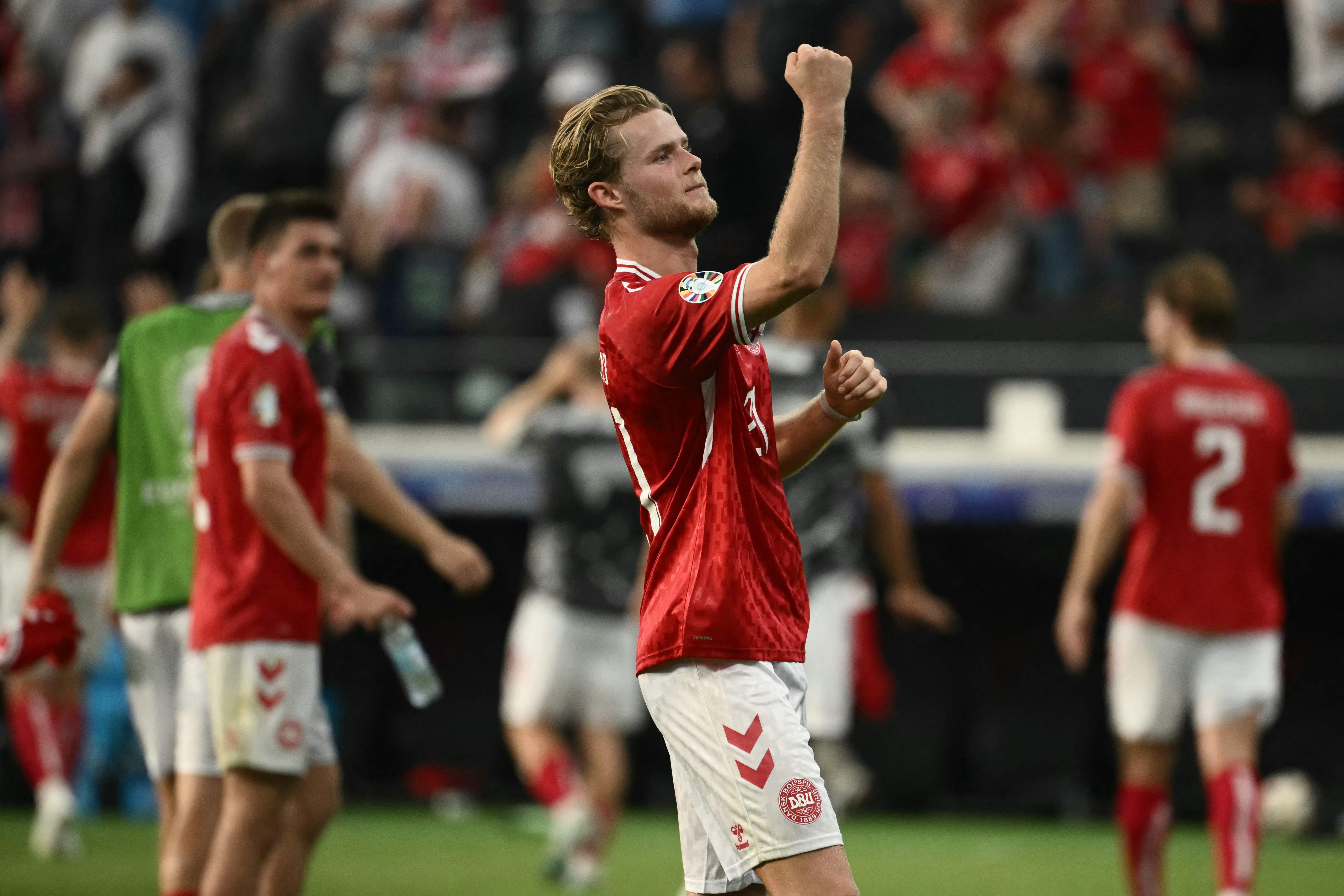 Denmark players including Denmark's midfielder #21 Morten Hjulmand react after the UEFA Euro 2024 Group C football match between Denmark and England at the Frankfurt Arena in Frankfurt am Main on June 20, 2024. (Photo by Angelos Tzortzinis / AFP)