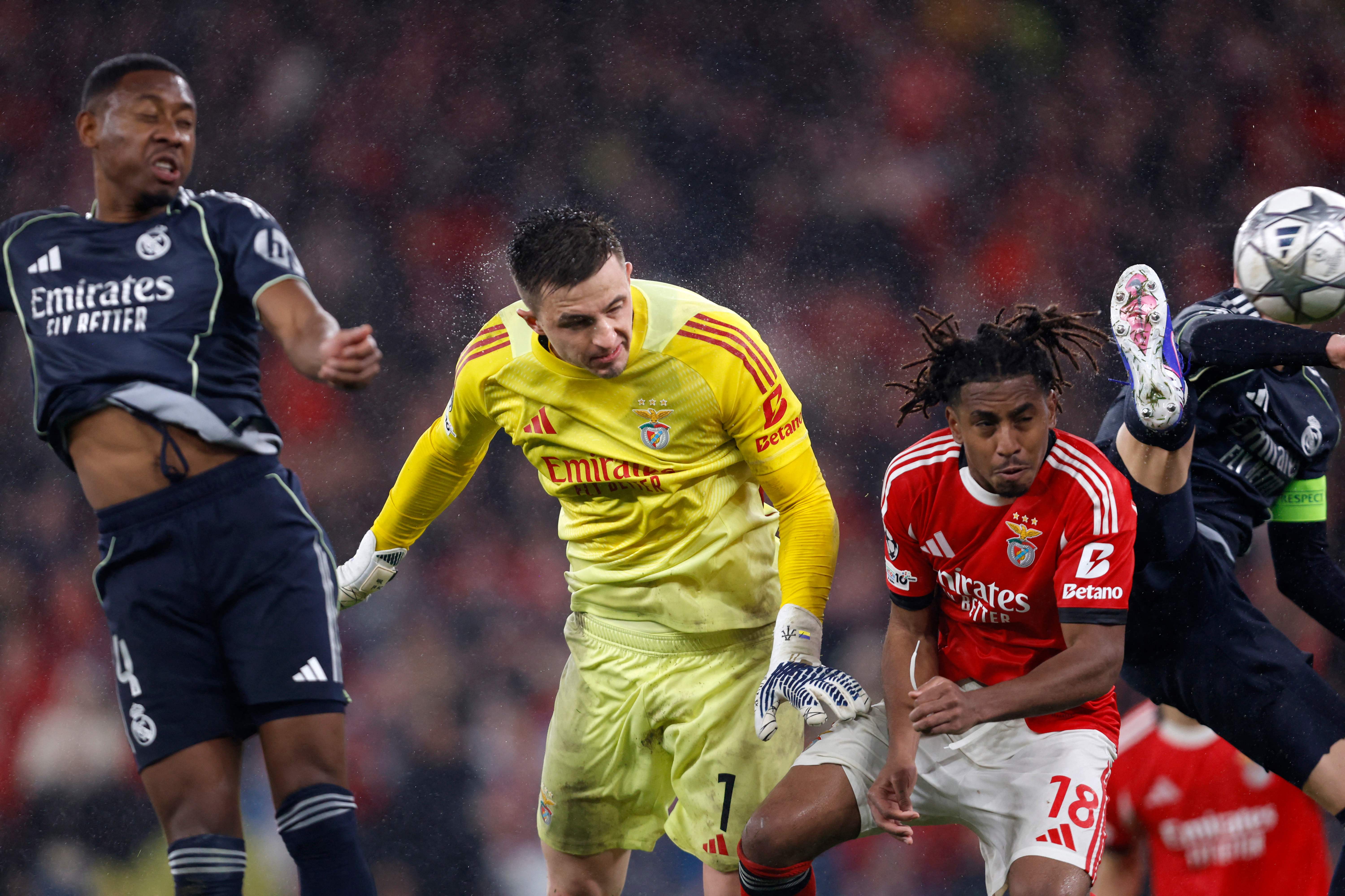 Benfica's Ukrainian goalkeeper #01 Anatoliy Trubin heads and scores his team's fourth goal during the UEFA Champions League league phase day 8 football match between SL Benfica and Real Madrid CF at Estadio da Luz in Lisbon on January 28, 2026. (Photo by FILIPE AMORIM / AFP)
