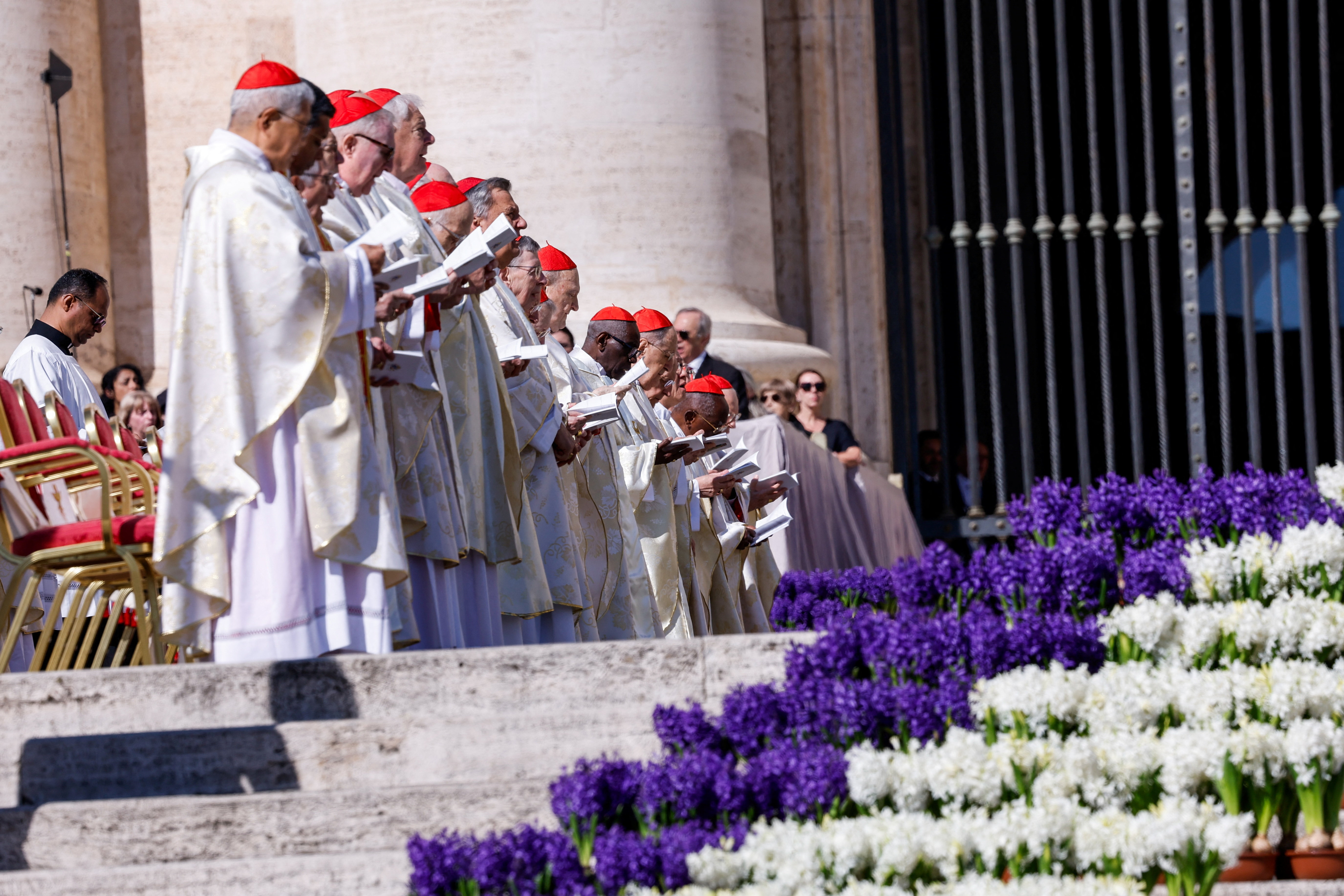 Clergy members attend the Easter Mass in St. Peter's Square at the Vatican, April 5, 2026. REUTERS/Remo Casilli