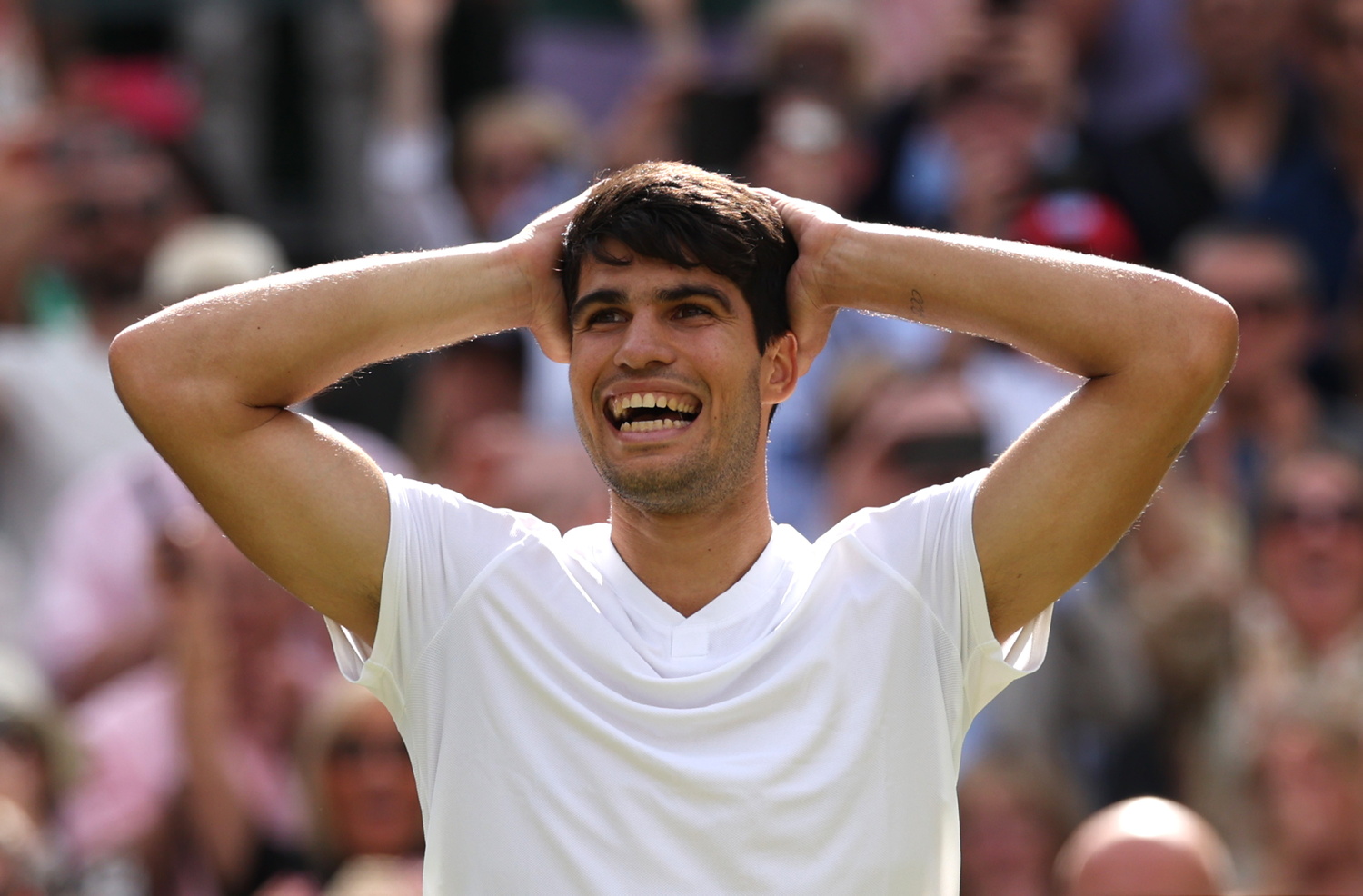 LONDON, ENGLAND - JULY 14: Carlos Alcaraz of Spain celebrates winning Championship point against Novak Djokovic of Serbia in the Gentlemen's Singles Final during day fourteen of The Championships Wimbledon 2024 at All England Lawn Tennis and Croquet Club on July 14, 2024 in London, England. (Photo by Clive Brunskill/Getty Images)