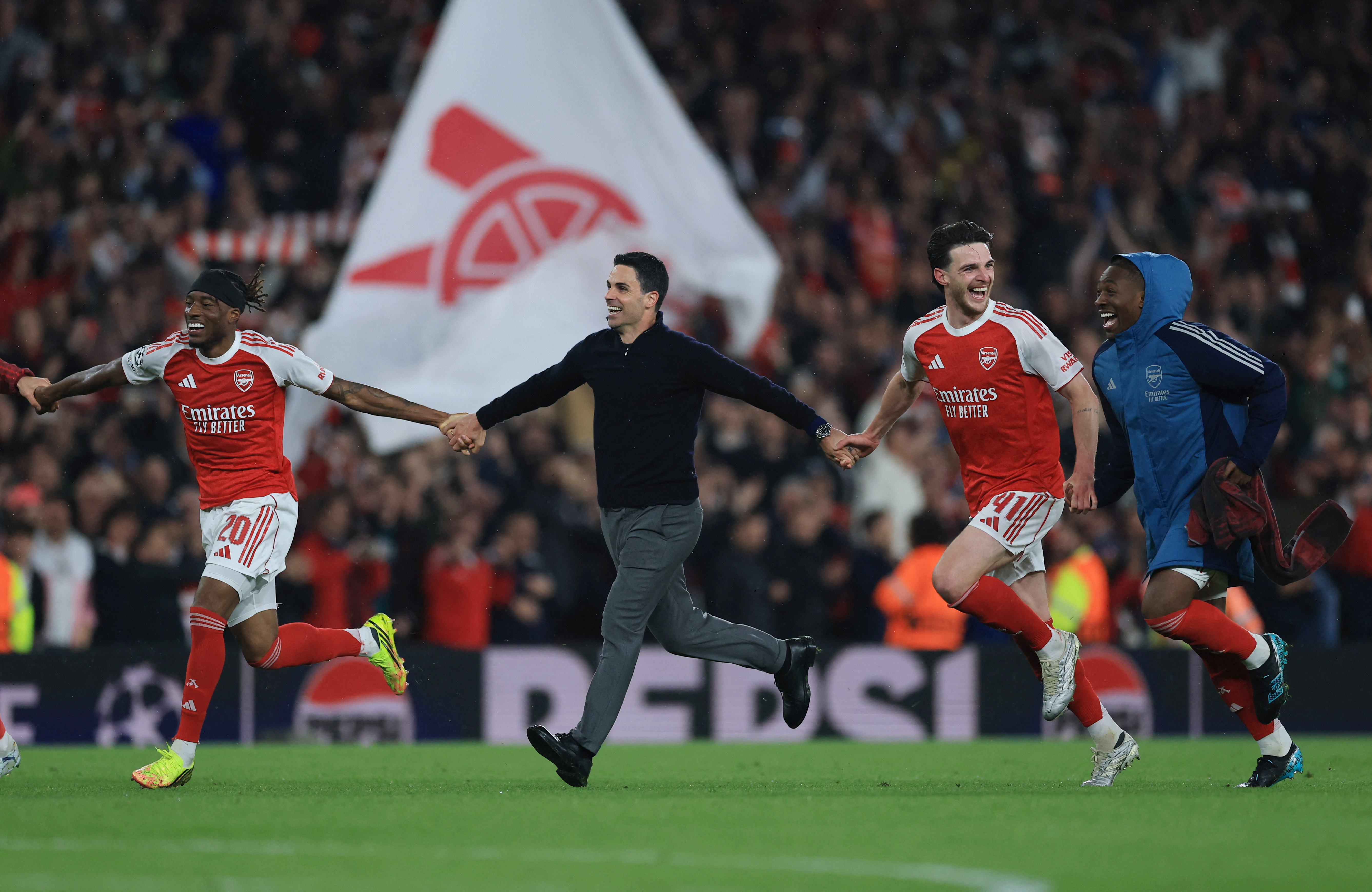 Soccer Football - UEFA Champions League - Semi Final - Second Leg - Arsenal v Atletico Madrid - Emirates Stadium, London, Britain - May 5, 2026 Arsenal's Noni Madueke, manager Mikel Arteta, Declan Rice and Eberechi Eze celebrate after reaching the UEFA Champions League final Action Images via Reuters/Paul Childs