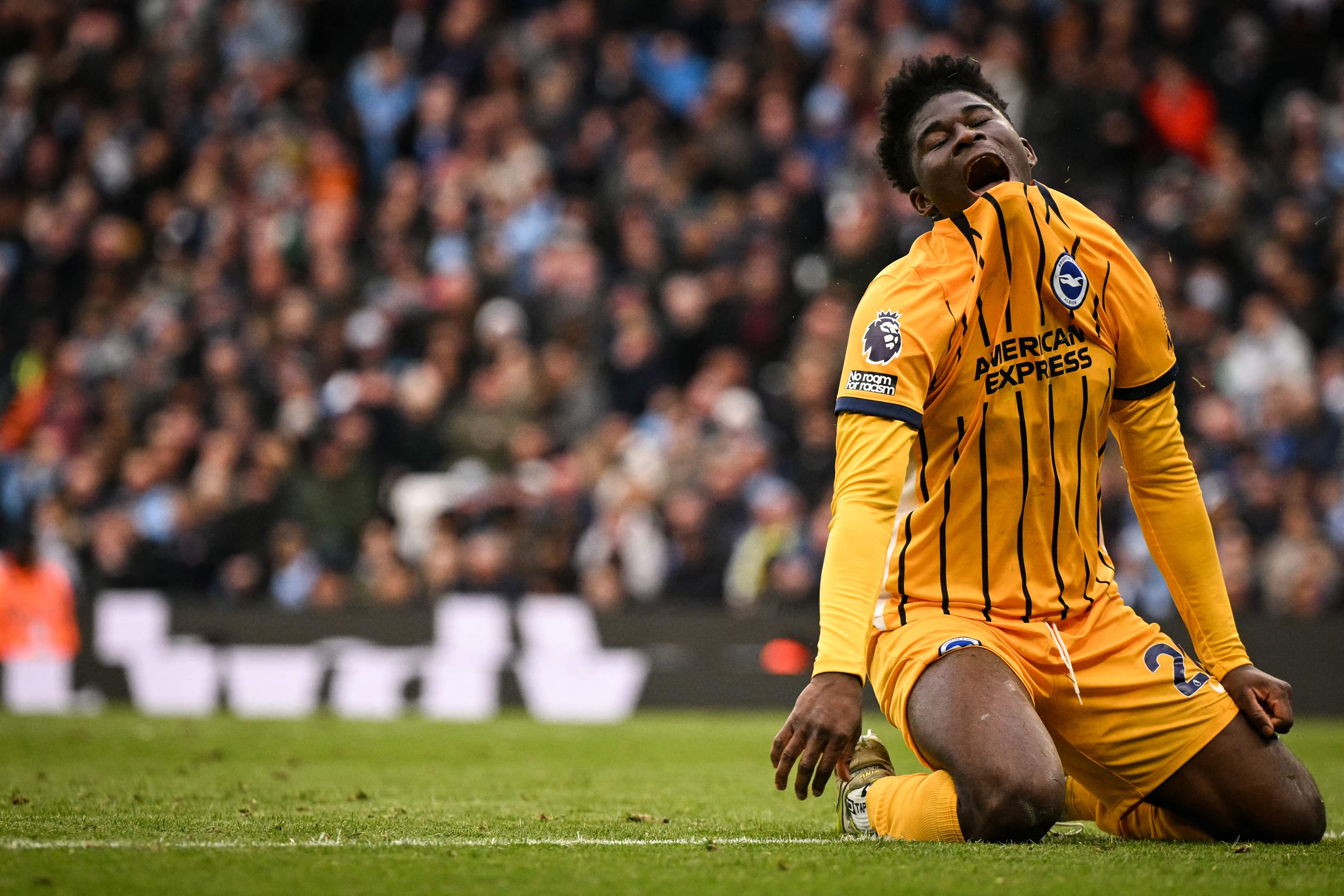 Brighton's Cameroonian midfielder #20 Carlos Baleba reacts after a missed chance during the English Premier League football match between Manchester City and Brighton and Hove Albion at the Etihad Stadium in Manchester, north west England, on March 15, 2025. (Photo by Oli SCARFF / AFP) / RESTRICTED TO EDITORIAL USE. No use with unauthorized audio, video, data, fixture lists, club/league logos or 'live' services. Online in-match use limited to 120 images. An additional 40 images may be used in extra time. No video emulation. Social media in-match use limited to 120 images. An additional 40 images may be used in extra time. No use in betting publications, games or single club/league/player publications. / 