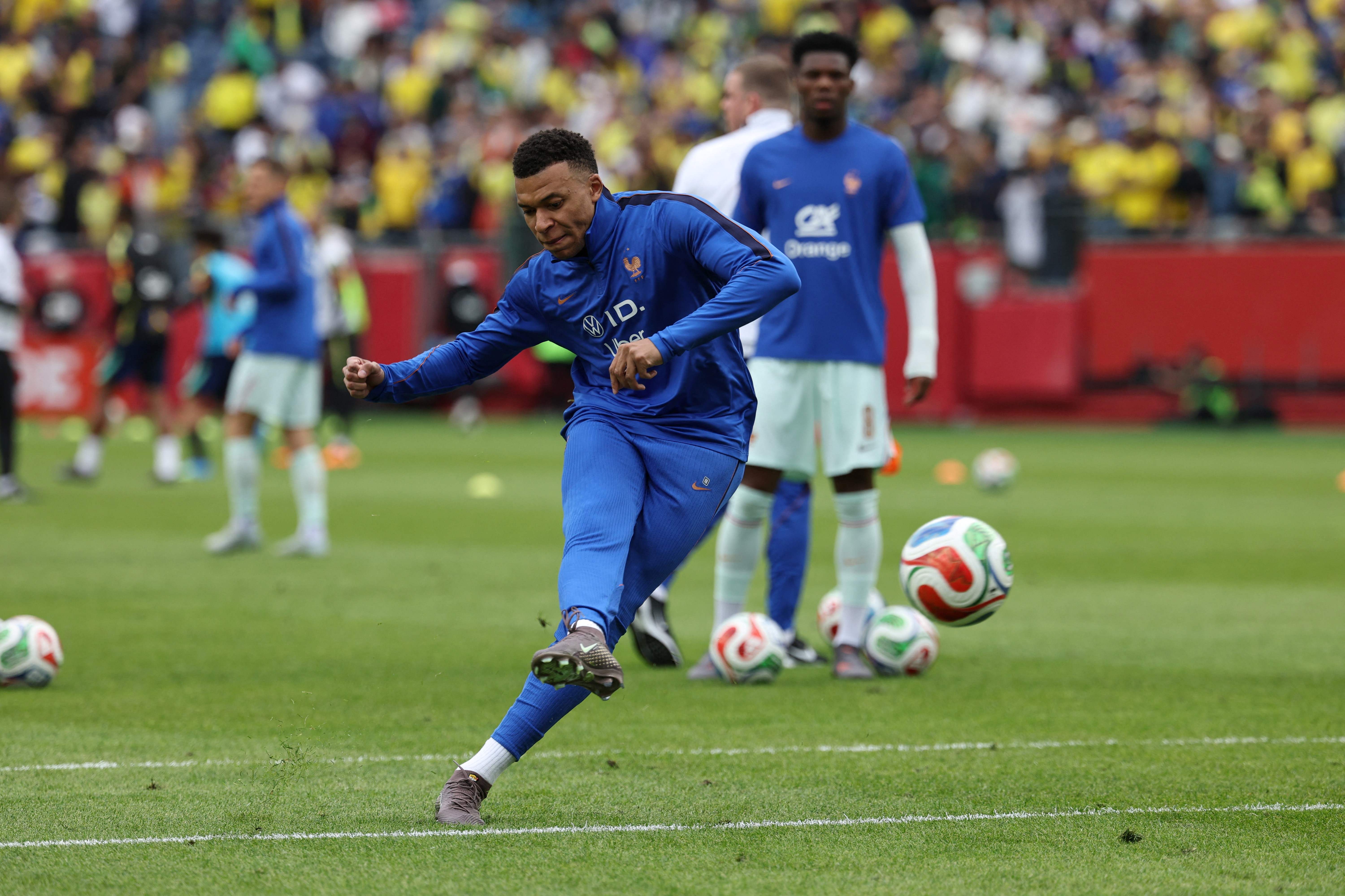 France forward and captain Kylian Mbappe warms up ahead of a friendly football match between Brazil and France at Gillette Stadium in Foxborough, Massachusetts, on March 26, 2026. (Photo by FRANCK FIFE / AFP)