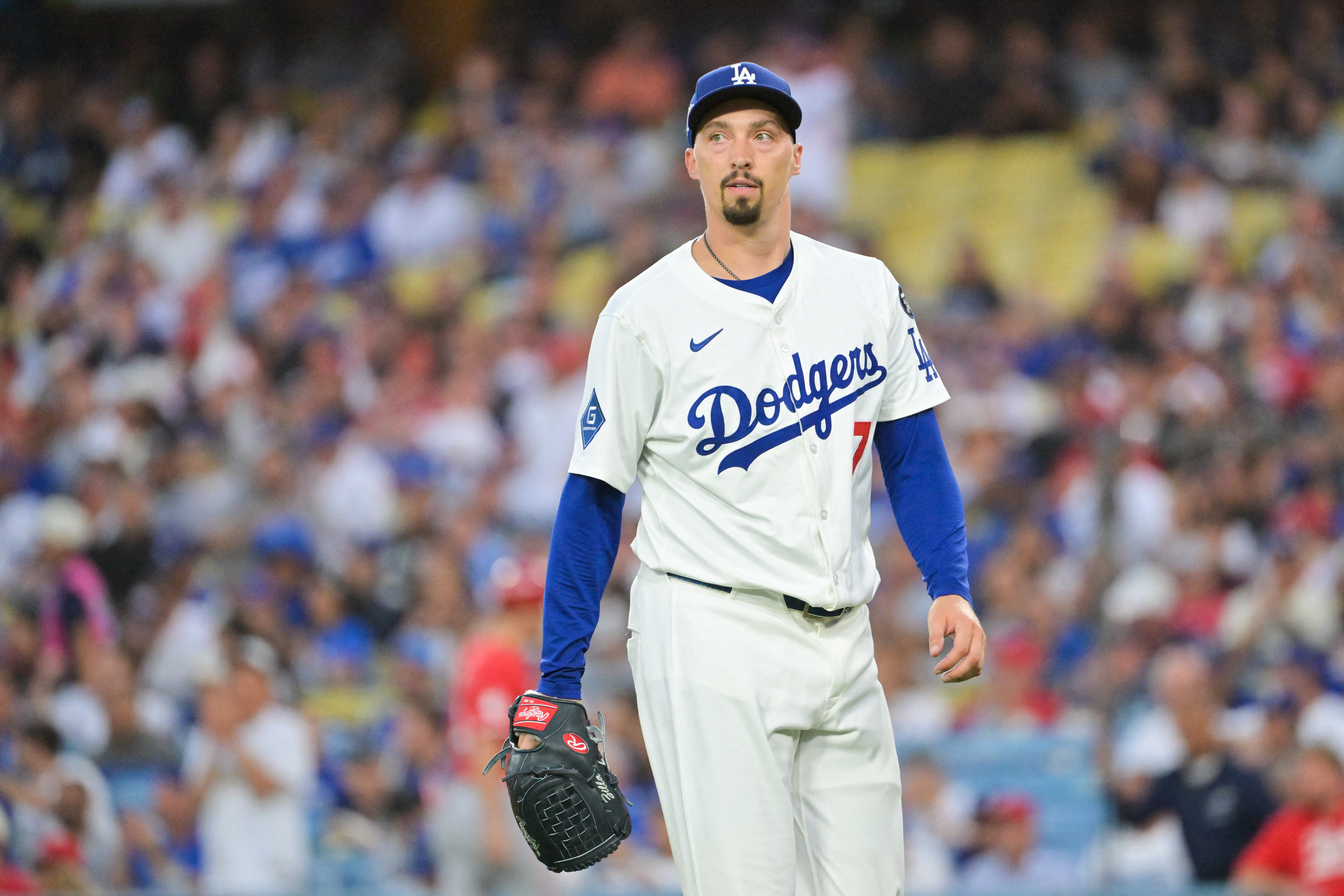 Sep 30, 2025; Los Angeles, California, USA; Los Angeles Dodgers starting pitcher Blake Snell (7) walks off the mound during the second inning against the Cincinnati Reds during game one of the Wildcard round for the 2025 MLB playoffs at Dodger Stadium. Mandatory Credit: Jayne Kamin-Oncea-Imagn Images