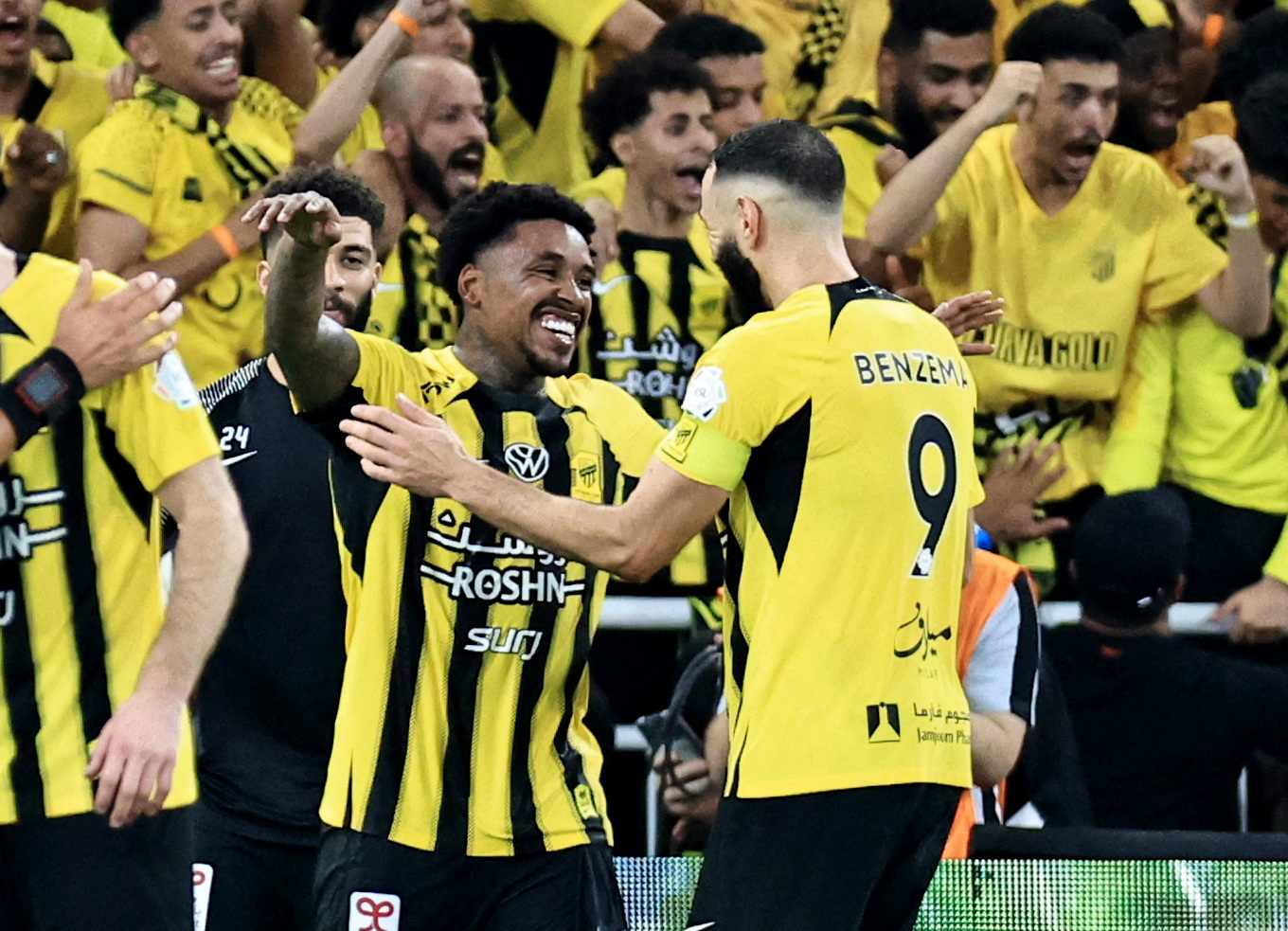 Soccer Football - Saudi Pro League - Al Ittihad v Al Nassr - King Abdullah Sport City, Jeddah, Saudi Arabia - December 6, 2024 Al Ittihad's Steven Bergwijn celebrates scoring their second goal with Karim Benzema REUTERS/Stringer