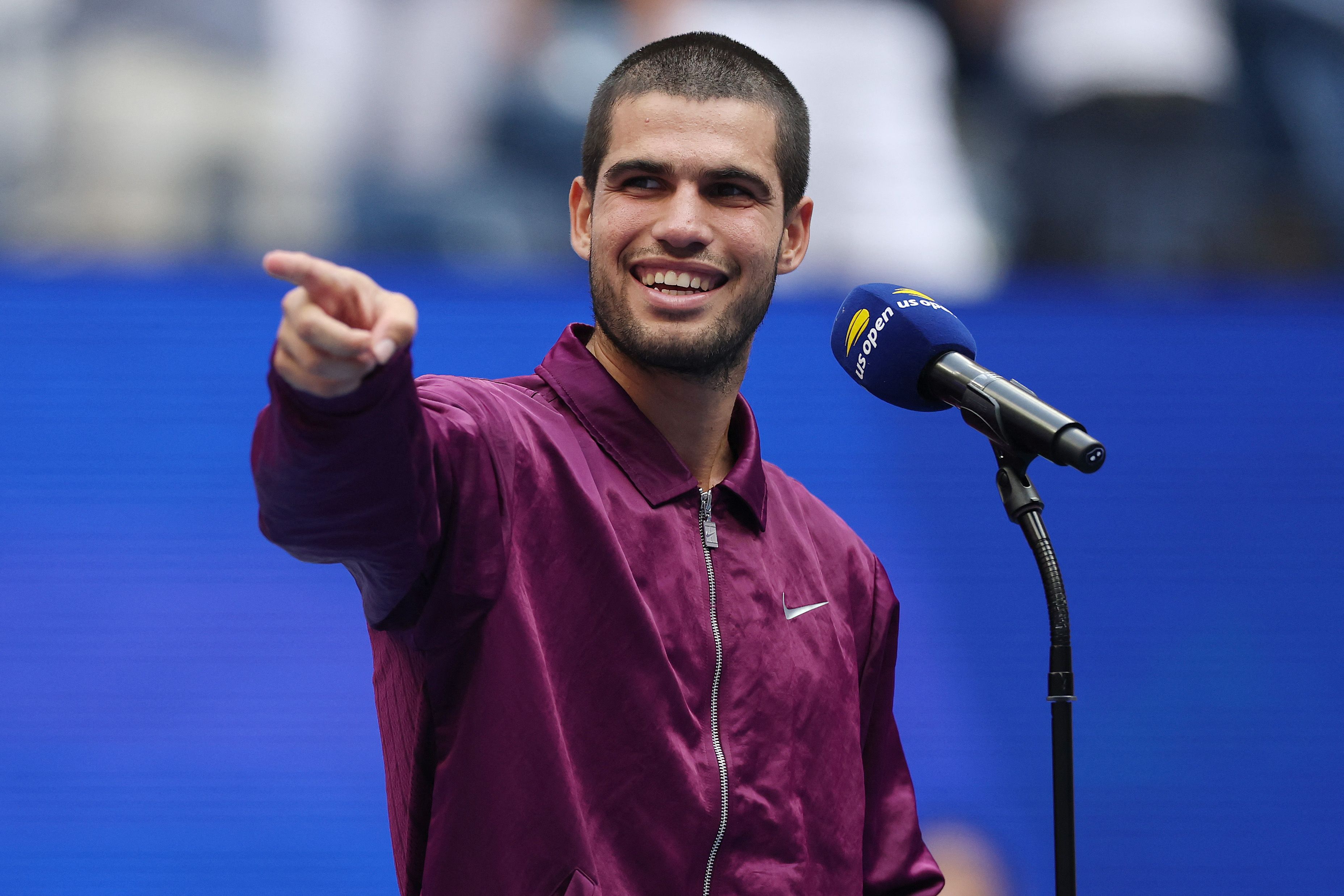 NEW YORK, NEW YORK - SEPTEMBER 05: Carlos Alcaraz of Spain reacts as he is interviewed after defeating Novak Djokovic of Serbia during their Men's Semifinal match on Day Thirteen of the 2025 US Open at USTA Billie Jean King National Tennis Center on September 5, 2025 in the Flushing neighborhood of the Queens borough of New York City.   Maddie Meyer/Getty Images/AFP (Photo by Maddie Meyer / GETTY IMAGES NORTH AMERICA / Getty Images via AFP)