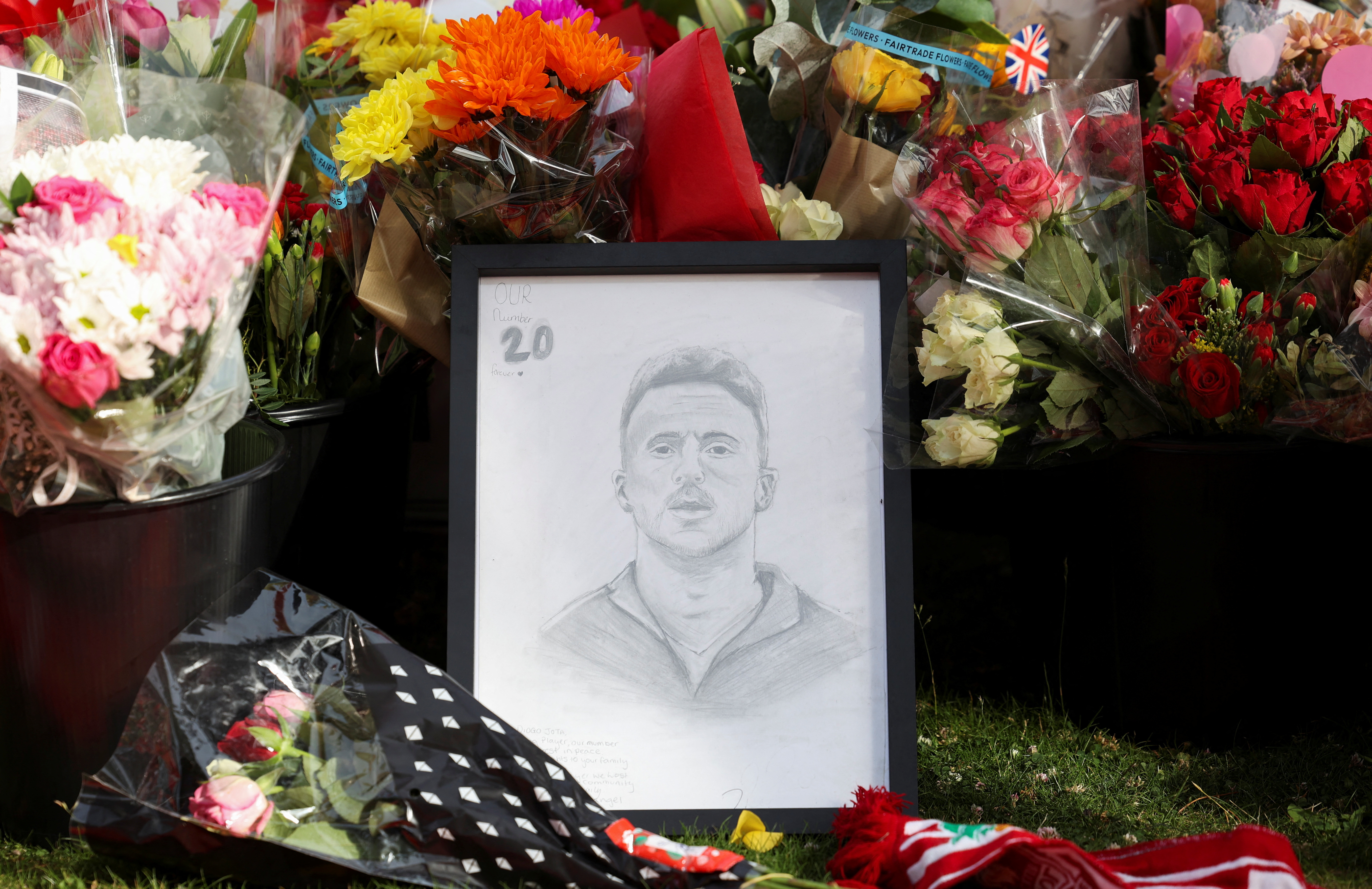Flower tributes and a sketch are left outside Liverpool's Anfield Stadium after Liverpool's Portuguese soccer player Diogo Jota died in a car crash near Zamora, Spain, in Liverpool, Britain, July 4, 2025. REUTERS/Temilade Adelaja