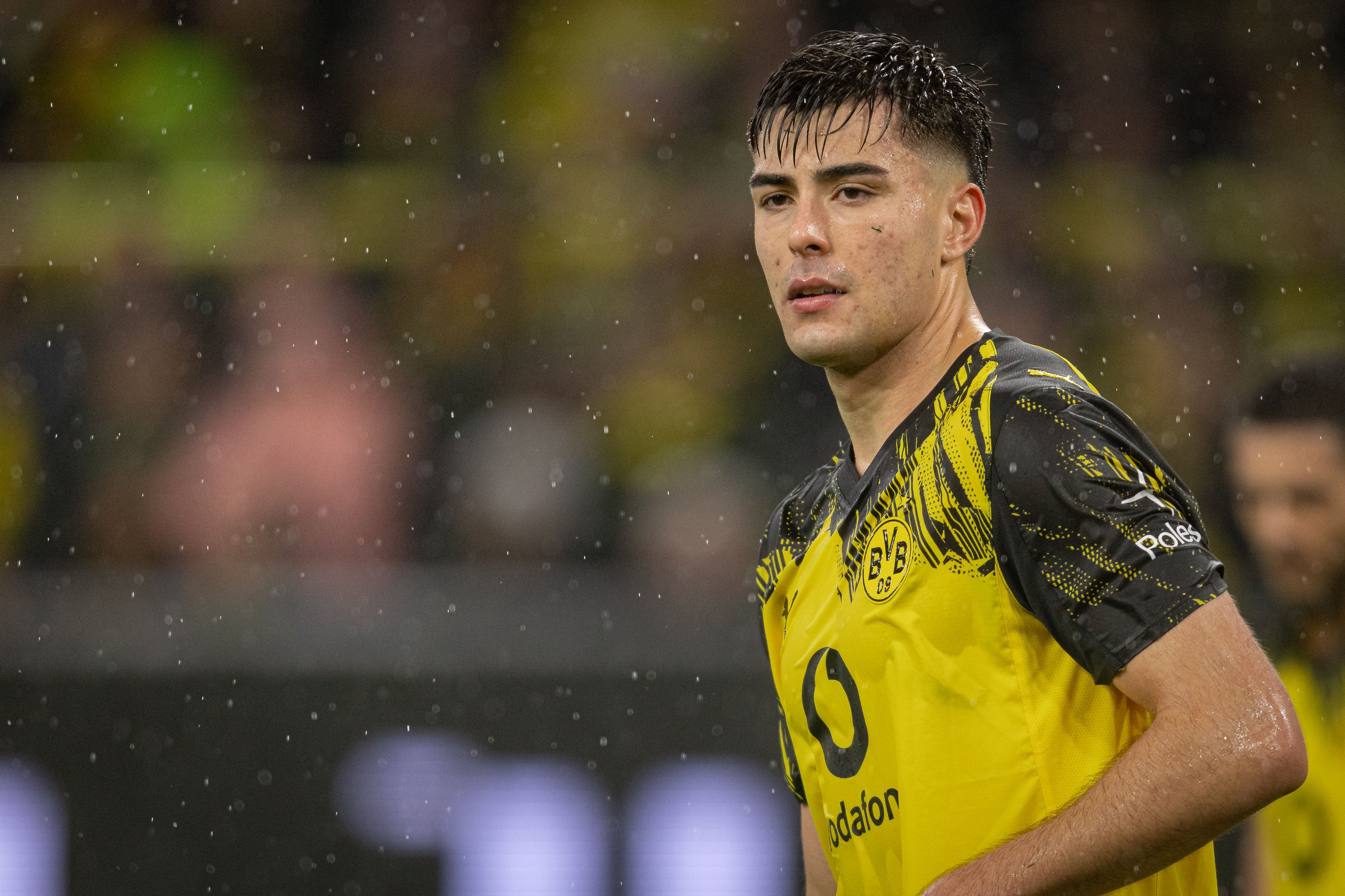 DORTMUND, GERMANY - DECEMBER 07: Aaron Anselmino of Borussia Dortmund looks on during the Bundesliga match between Borussia Dortmund and TSG Hoffenheim at Signal Iduna Park on December 07, 2025 in Dortmund, Germany. (Photo by Inaki Esnaola/Getty Images)
