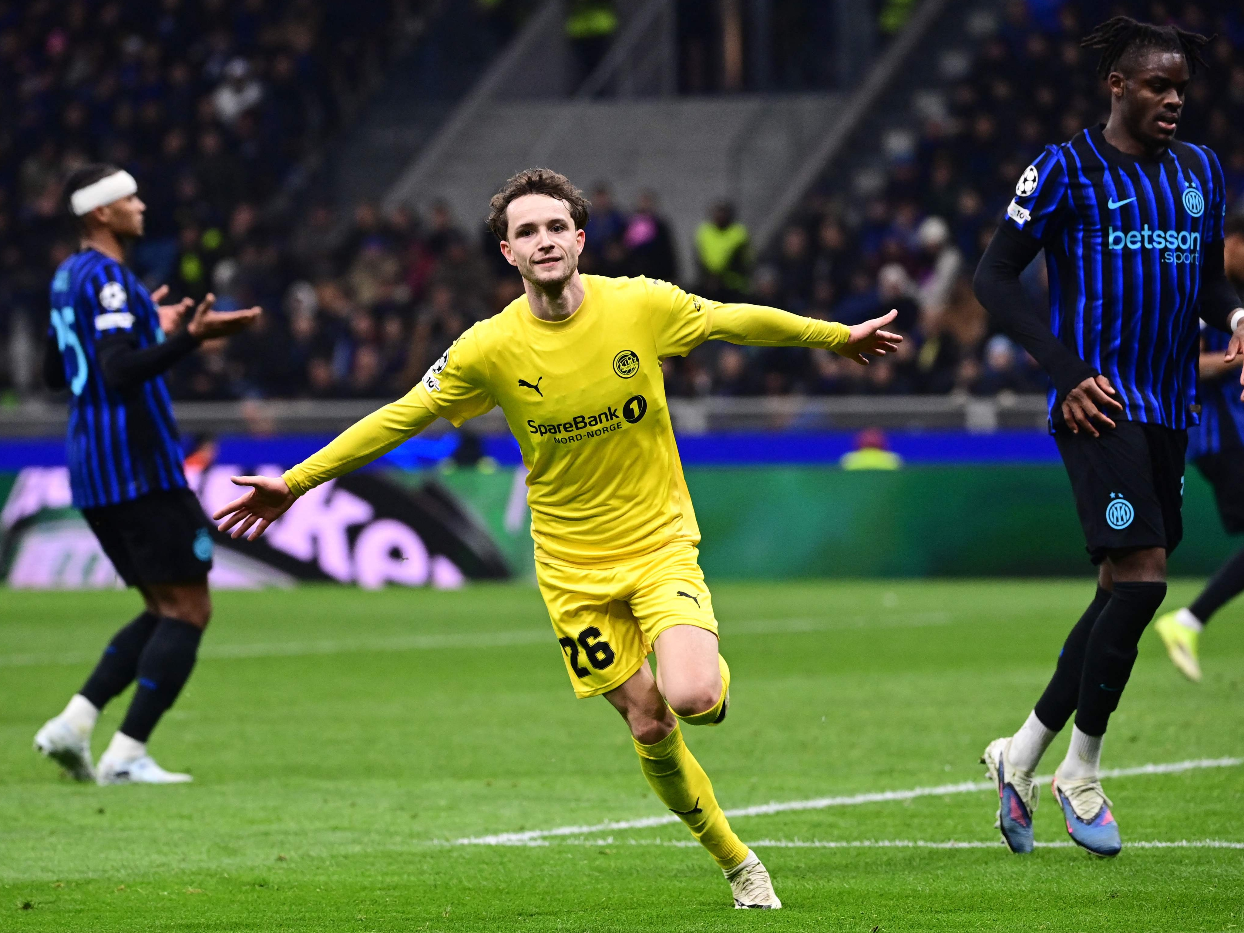 TOPSHOT - Bodo/Glimt's Norwegian forward #26 Hakon Evjen celebrates scoring his team's second goal during the UEFA Champions League second-leg play-off football match between Inter Milan and Bodo/Glimt at San Siro stadium in Milan, northern Italy, on February 24, 2026. (Photo by PIERO CRUCIATTI / AFP)
