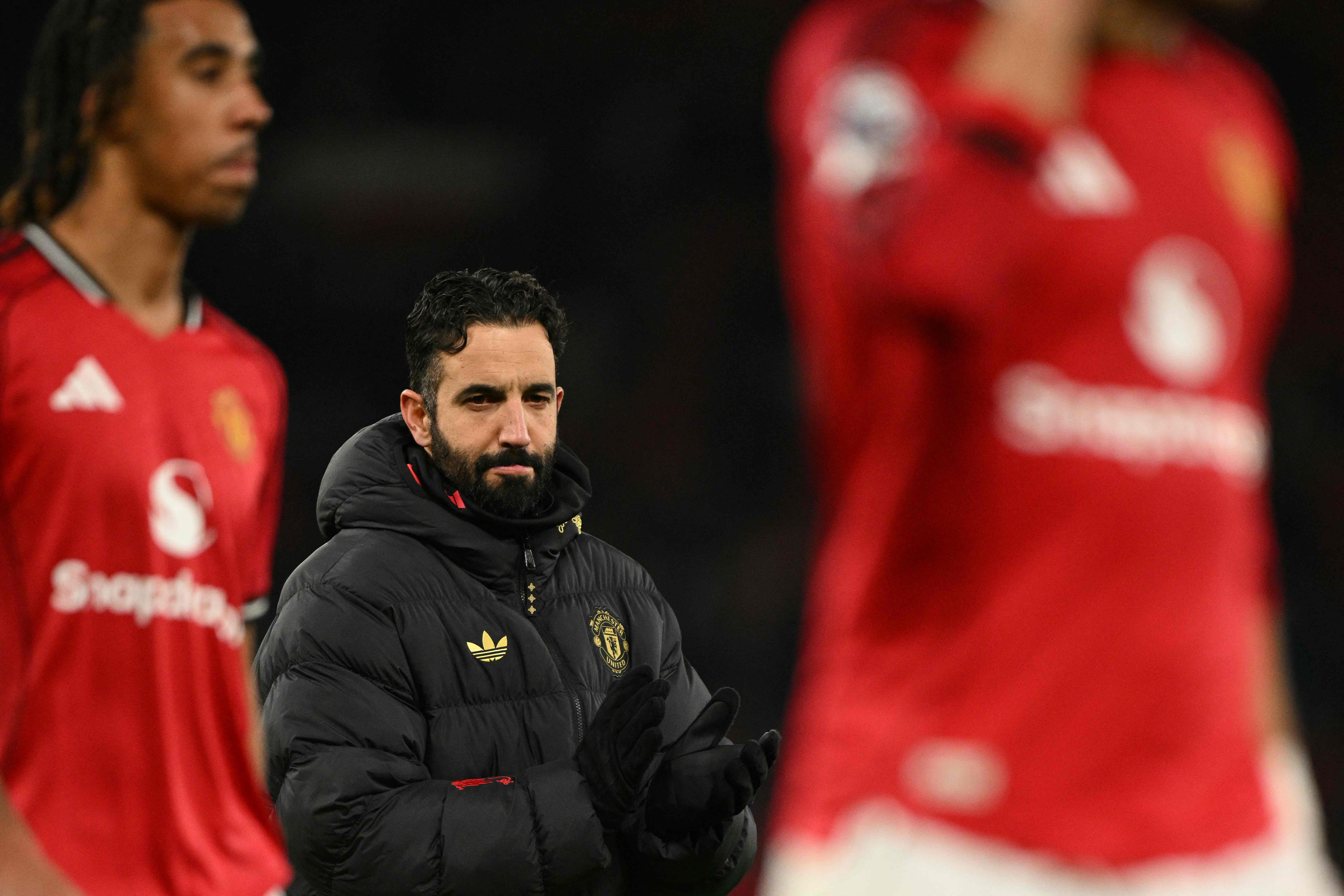 Manchester United's Portuguese head coach Ruben Amorim reacts at the end of the English Premier League football match between Manchester United and Wolverhampton Wanderers at Old Trafford in Manchester, north west England, on December 30, 2025. (Photo by Oli SCARFF / AFP) / RESTRICTED TO EDITORIAL USE. No use with unauthorized audio, video, data, fixture lists, club/league logos or 'live' services. Online in-match use limited to 120 images. An additional 40 images may be used in extra time. No video emulation. Social media in-match use limited to 120 images. An additional 40 images may be used in extra time. No use in betting publications, games or single club/league/player publications. /