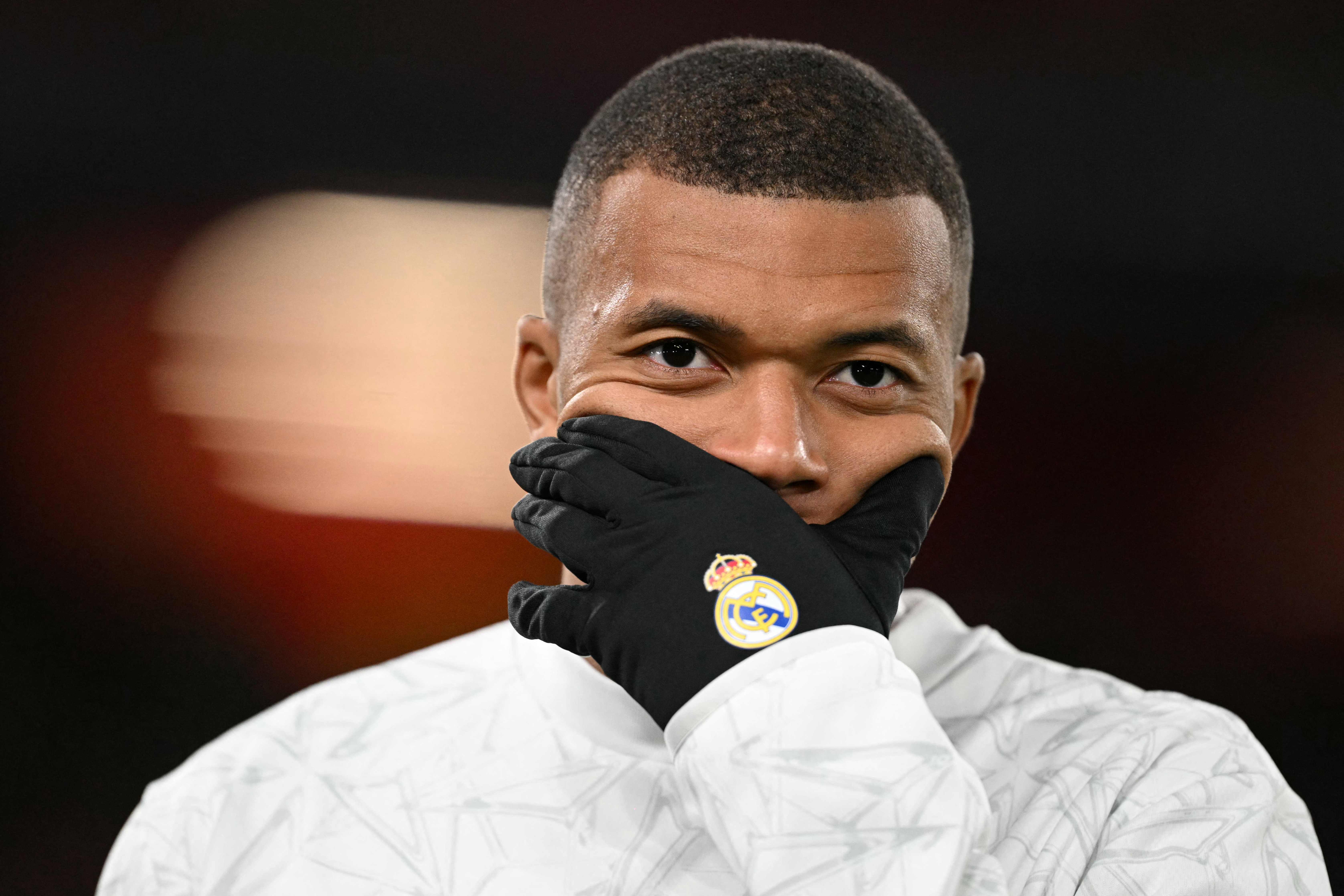 Real Madrid's French forward #09 Kylian Mbappe warms up ahead of the UEFA Champions League football match between Liverpool and Real Madrid at Anfield in Liverpool, north west England on November 27, 2024. (Photo by Oli SCARFF / AFP)