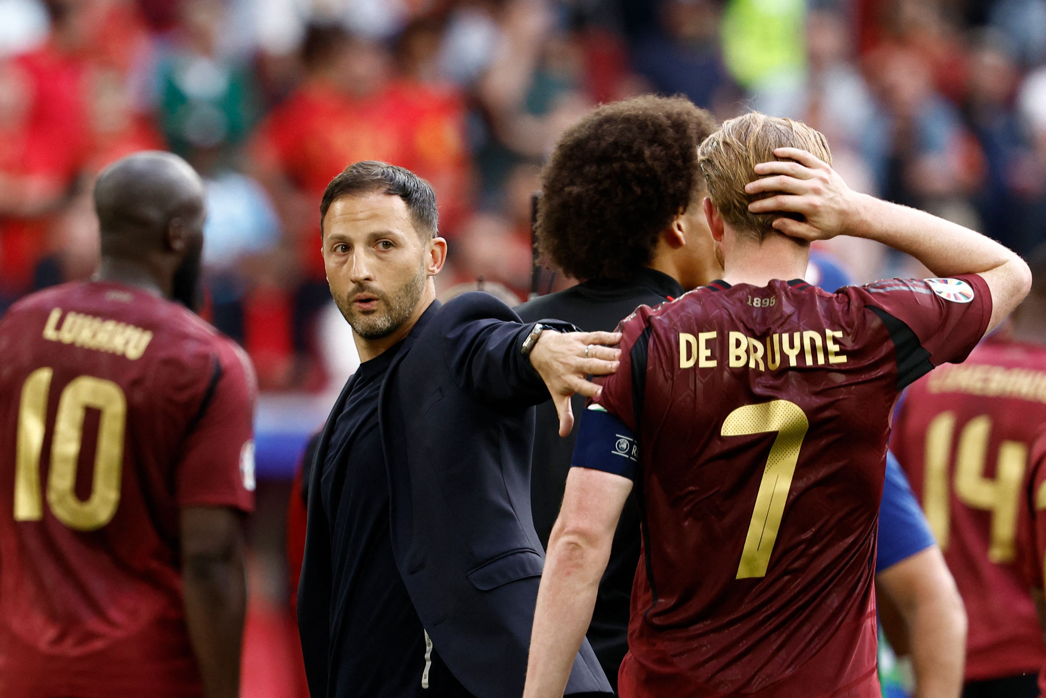 Belgium's head coach Domenico Tedesco cheers Belgium's midfielder #07 Kevin De Bruyne at the end of the UEFA Euro 2024 round of 16 football match between France and Belgium at the Duesseldorf Arena in Duesseldorf on July 1, 2024. (Photo by KENZO TRIBOUILLARD / AFP)