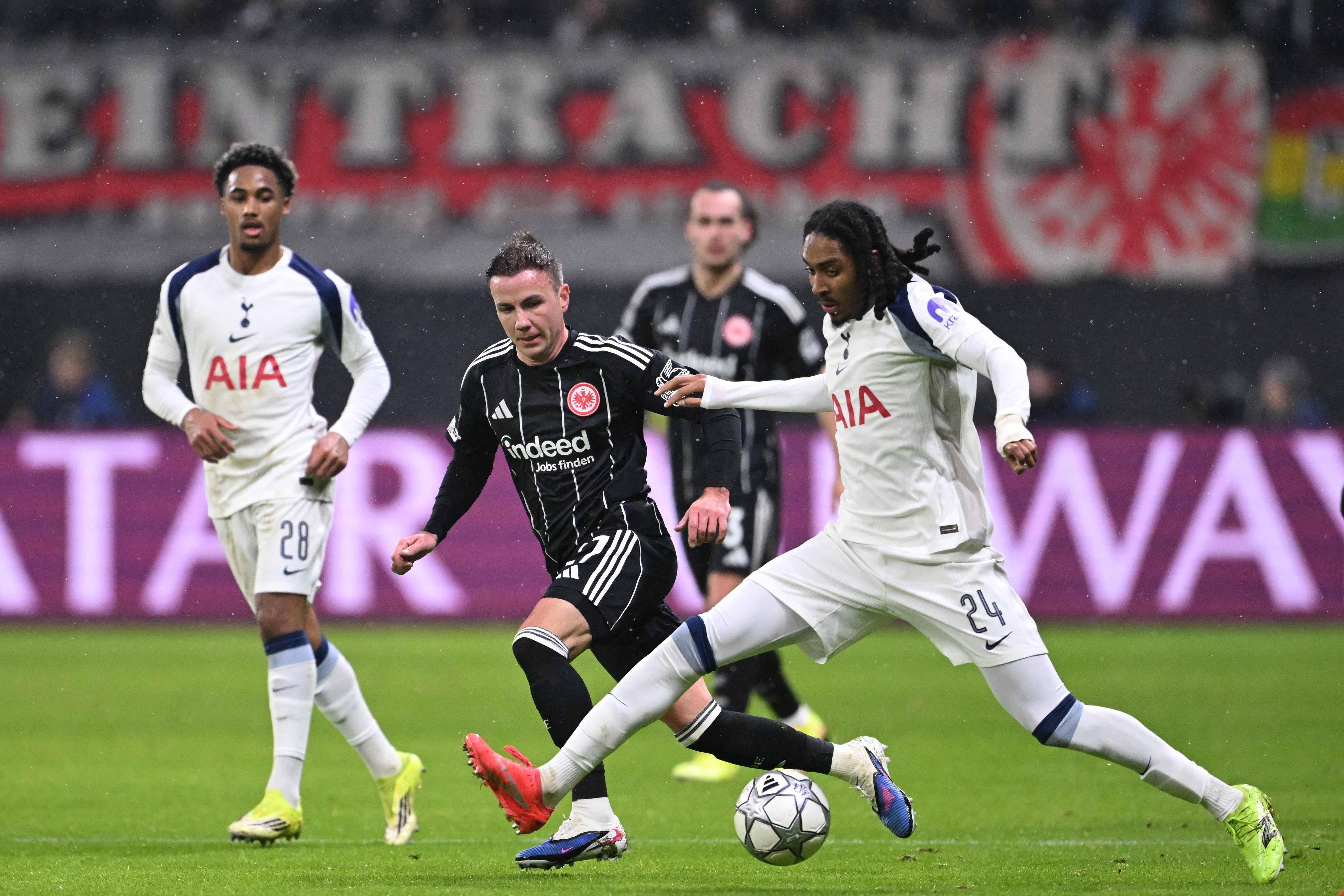 Frankfurt's German midfielder #27 Mario Goetze and Tottenham Hotspur's English defender #24 Djed Spence vie for the ball during the UEFA Champions League league phase- day 8 football match between Eintracht Frankfurt and Tottenham Hotspur in Frankfurt, western Germany, on January 28, 2026. (Photo by Kirill KUDRYAVTSEV / AFP)