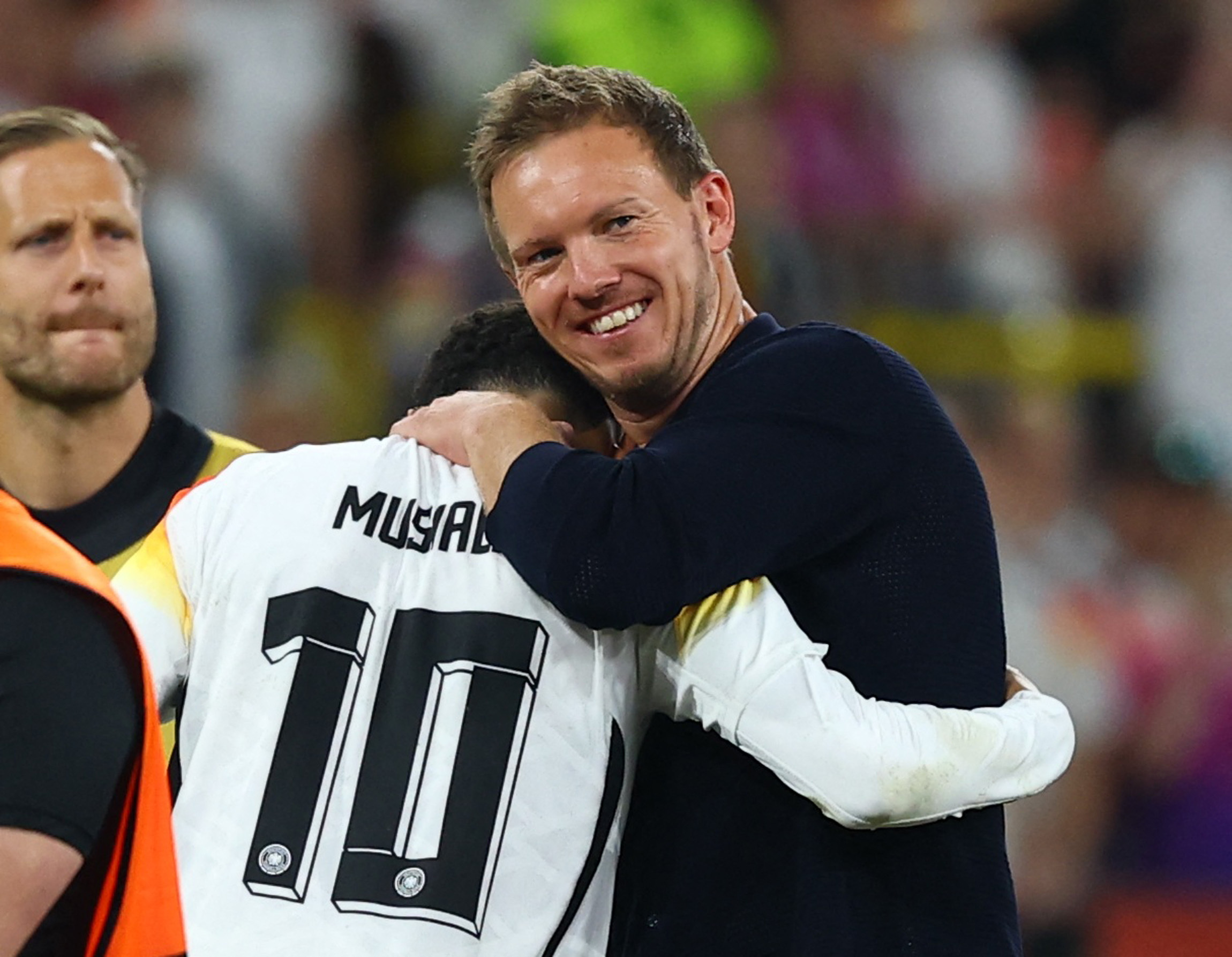 Soccer Football - Euro 2024 - Round of 16 - Germany v Denmark - Dortmund BVB Stadion, Dortmund, Germany - June 29, 2024 Germany coach Julian Nagelsmann celebrates with Jamal Musiala after the match REUTERS/Kai Pfaffenbach