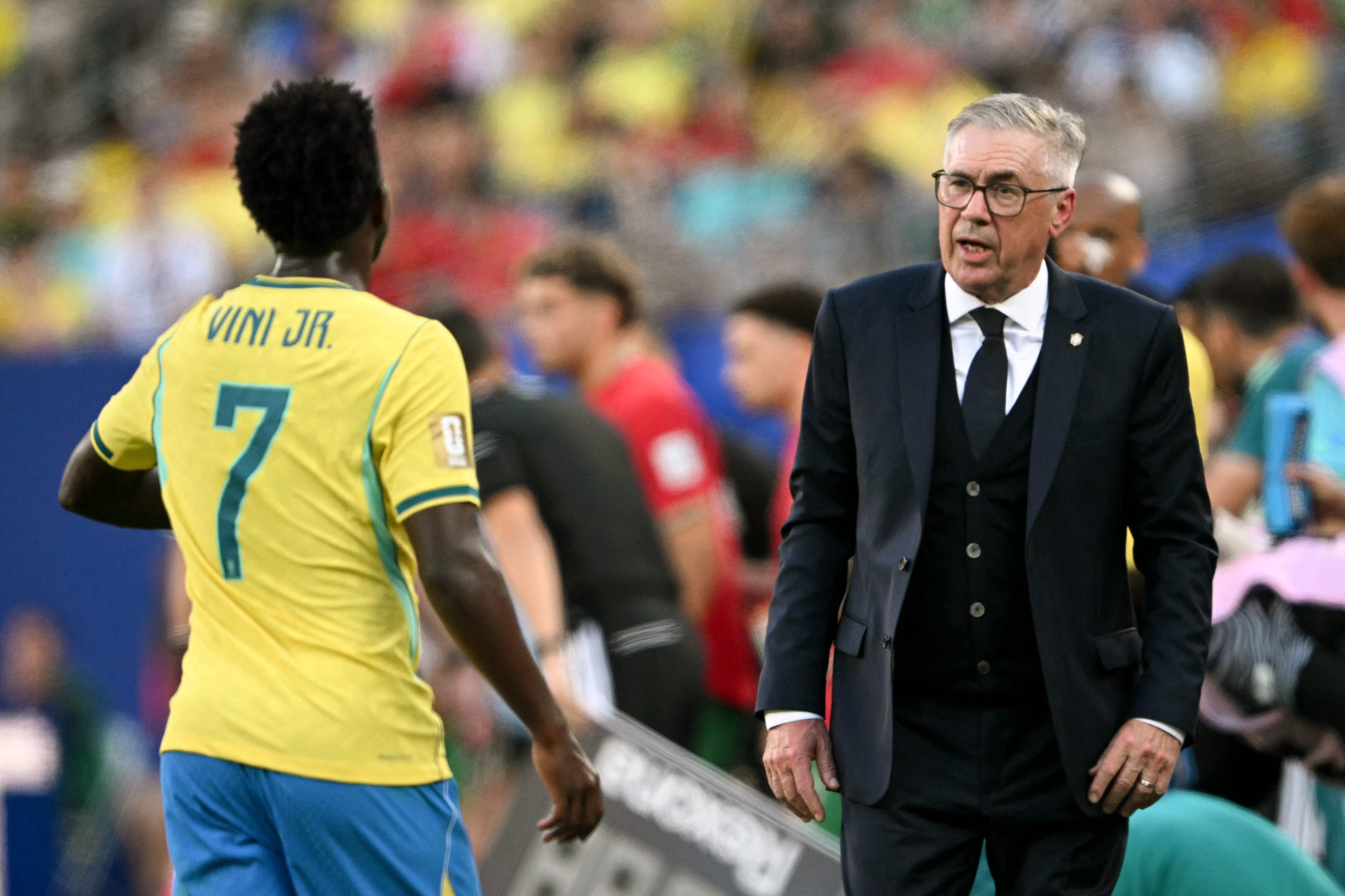 Brazil's Italian head coach Carlo Ancelotti speaks to forward #07 Vinicius Junior during the 2026 World Cup Group C football match between Brazil and Morocco at the New York/New Jersey Stadium in East Rutherford on June 13, 2026. (Photo by MAURO PIMENTEL / AFP)